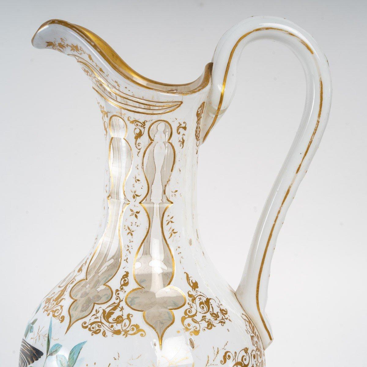 Bohemian service, 19th century
Bohemian crystal overlay service, 19th century, consists of a carafe and a glass, the carafe has a special handle painted with a bird and butterflies.
Bohemian service, 19th century
Measures: Carafe - H: 35 cm, W:
