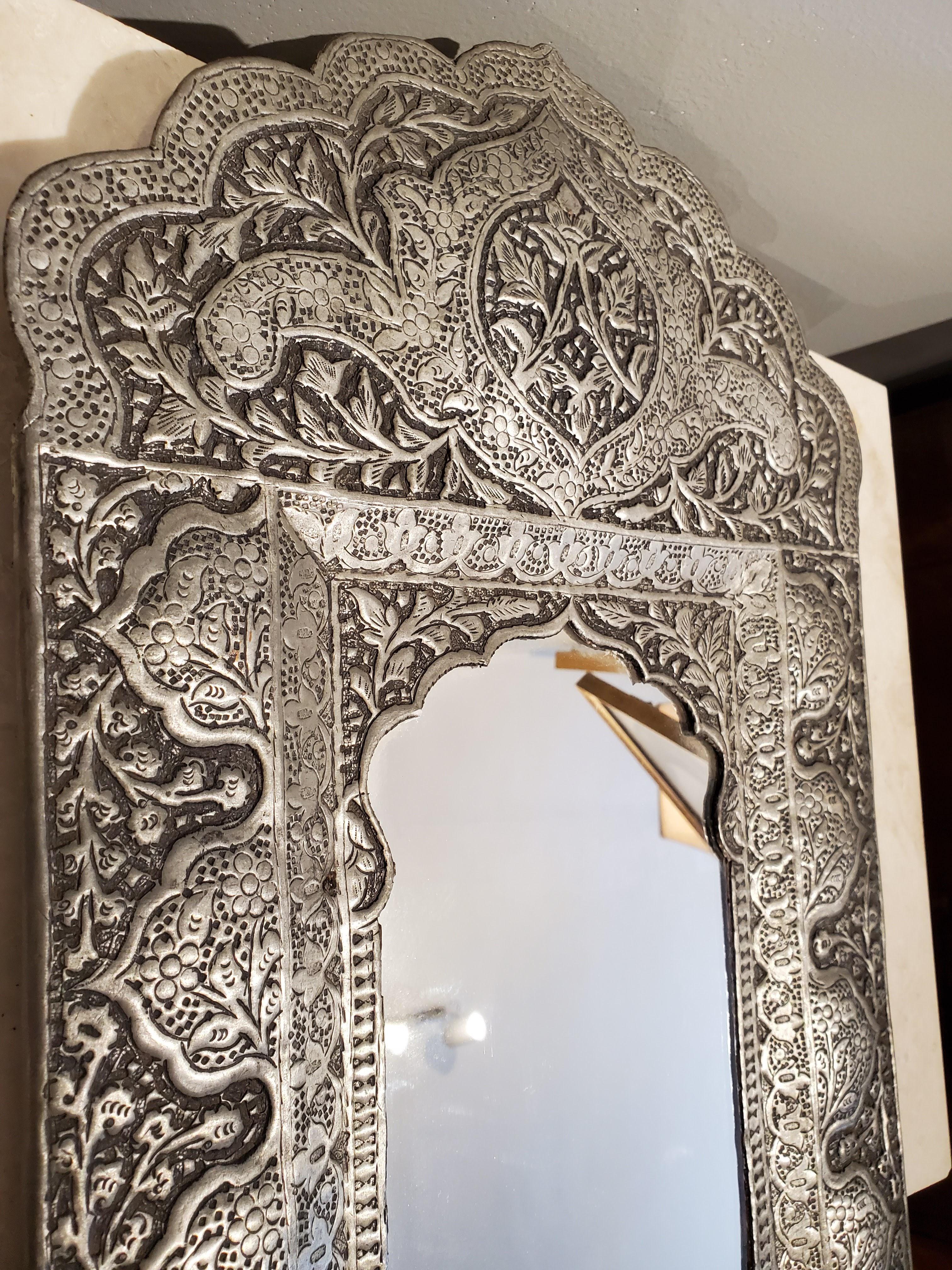 Intricately hammered and faceted designs with shaped crests over Moorish arches. Beautiful for bohemian inspired design. Great for hallways and small spaces. 
Made in India. 
Measures: 19