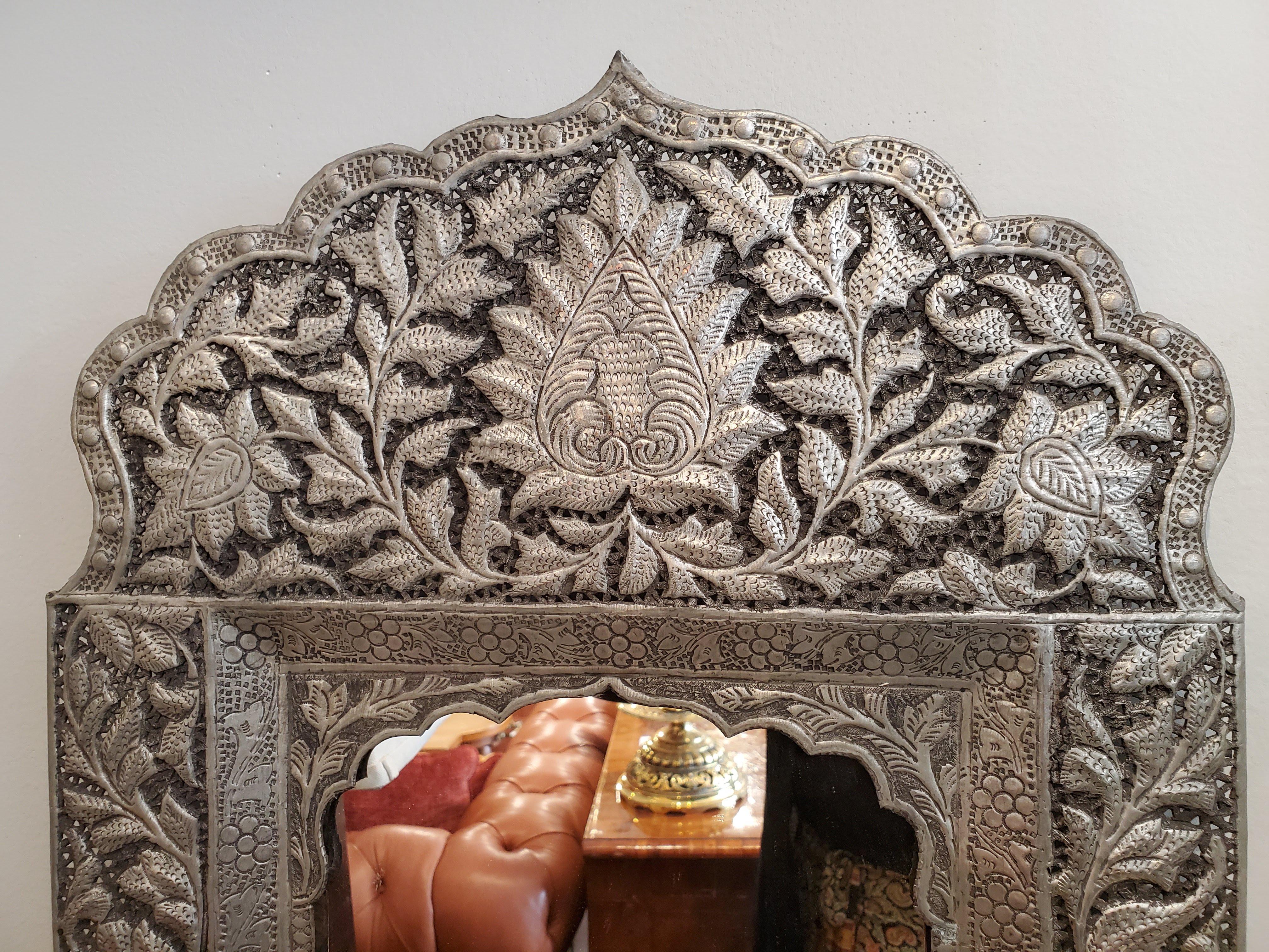 Intricately hammered and faceted designs with shaped crests over Moorish arches. Beautiful for bohemian inspired design. Great for hallways and small spaces. 
Measures: 23