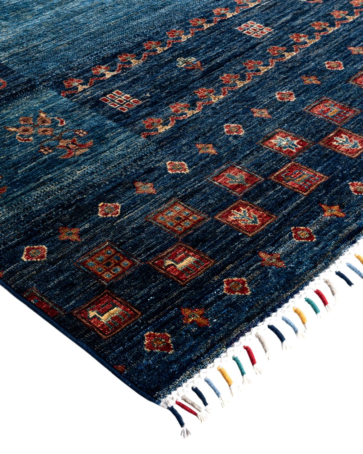 The rich textile tradition of western Africa inspired the Tribal collection of hand-knotted rugs. Incorporating a medley of geometric motifs, in palettes ranging from earthy to vivacious, these rugs bring a sense of energy as well as plush texture