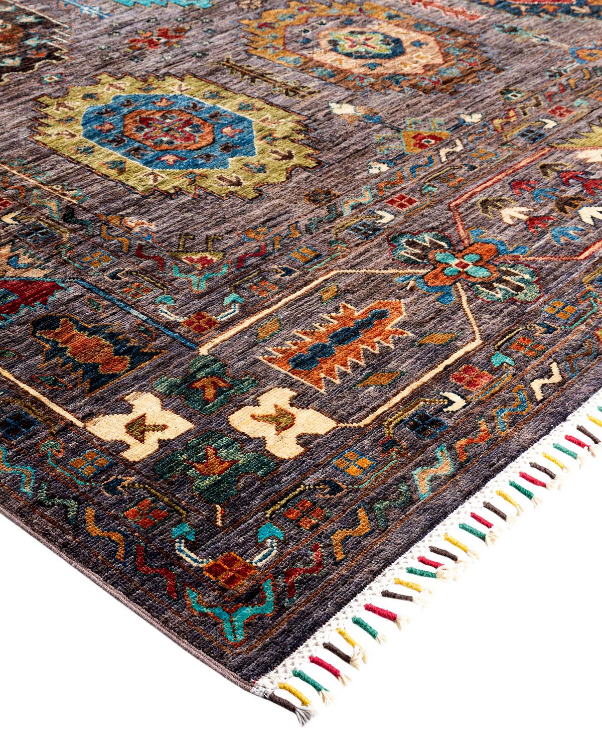 The rich textile tradition of western Africa inspired the Tribal collection of hand-knotted rugs. Incorporating a medley of geometric motifs, in palettes ranging from earthy to vivacious, these rugs bring a sense of energy as well as plush texture
