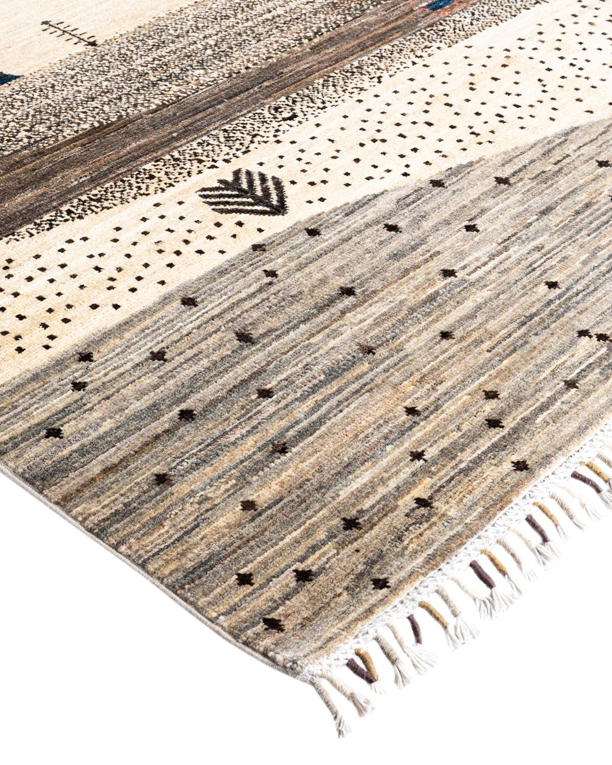 The rich textile tradition of western Africa inspired the Tribal collection of hand-knotted rugs. Incorporating a medley of geometric motifs, in palettes ranging from earthy to vivacious, these rugs bring a sense of energy as well as plush texture