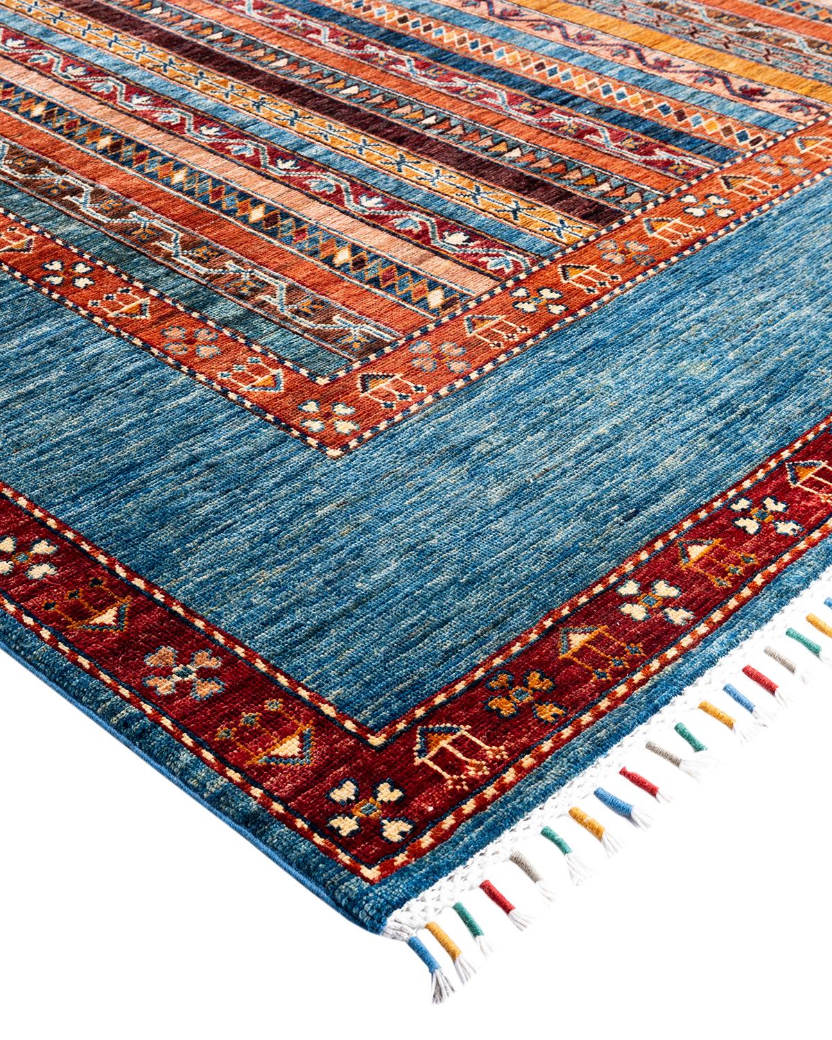 The rich textile tradition of western Africa inspired the Tribal collection of hand-knotted rugs. Incorporating a medley of geometric motifs, in palettes ranging from earthy to vivacious, these rugs bring a sense of energy as well as plush texture