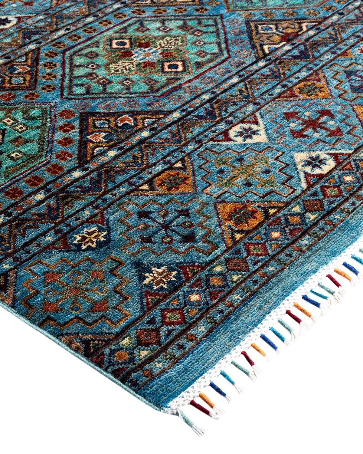 The rich textile tradition of western Africa inspired the Tribal collection of hand-knotted rugs. Incorporating a medley of geometric motifs, in palettes ranging from earthy to vivacious, these rugs bring a sense of energy as well as plush texture