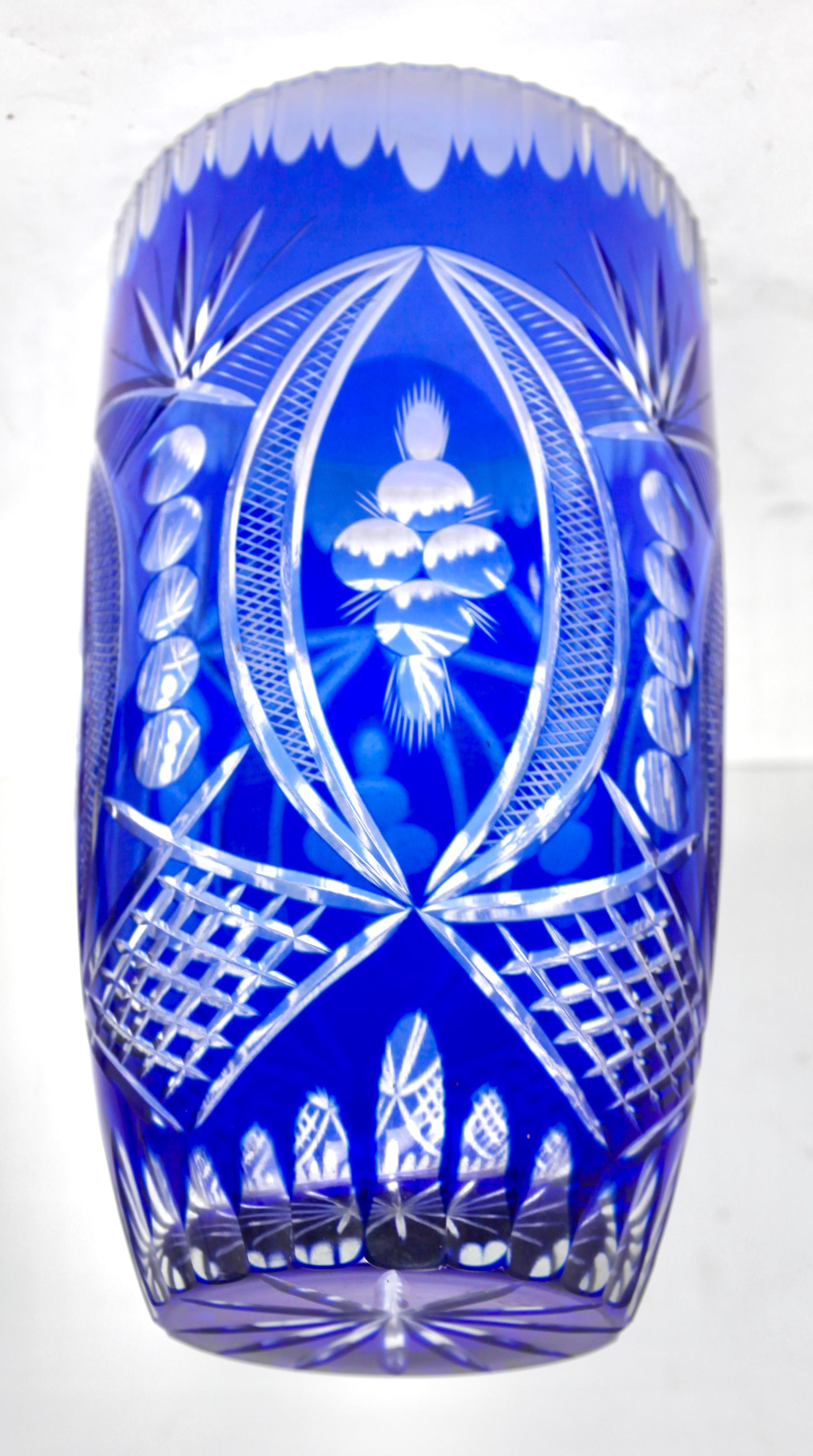 Bohemian Cobalt overlay cut-crystal vase, mid 20th century.
looks simply stunning.
Weight crystal 2.3 kg 

The piece is in excellent condition and a real beauty!

 