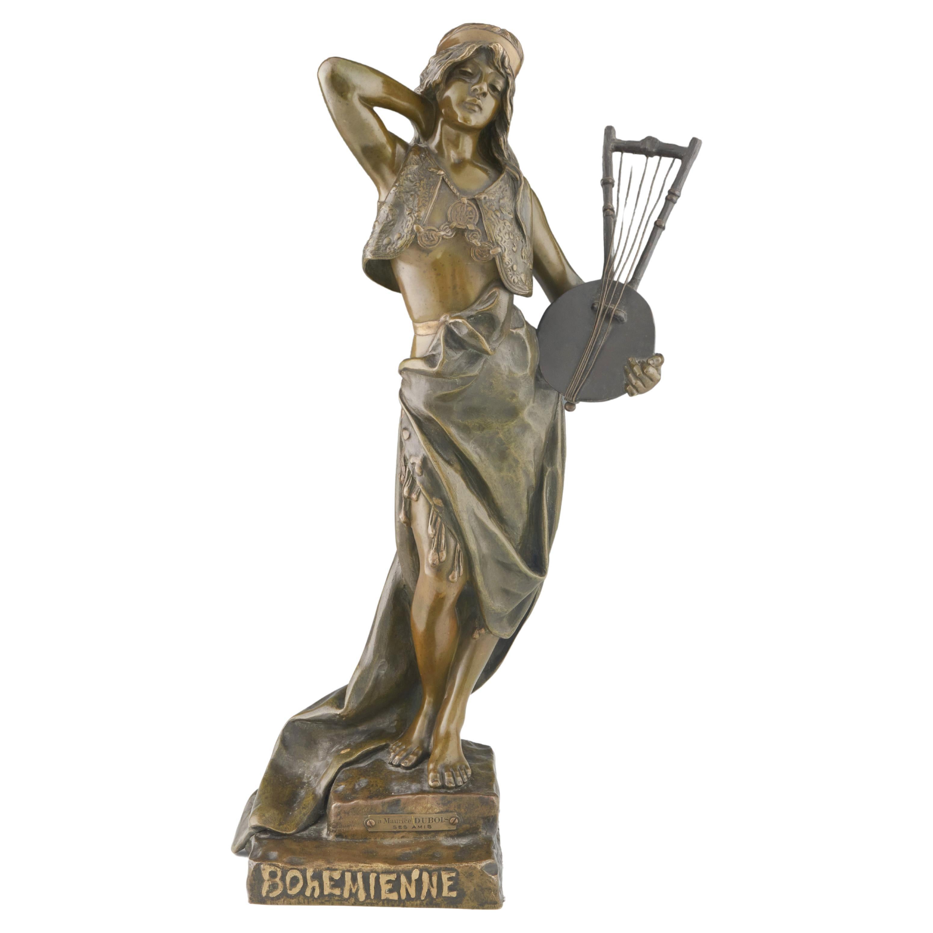 'Bohemienne' An Art Nouveau bronze sculpture by Emmanuel Villanis (1858-1914), depicting an elegant young woman holding a lyre with her other arm raised behind her head with robes flowing down. Excellent rich brown patination with fine detail.