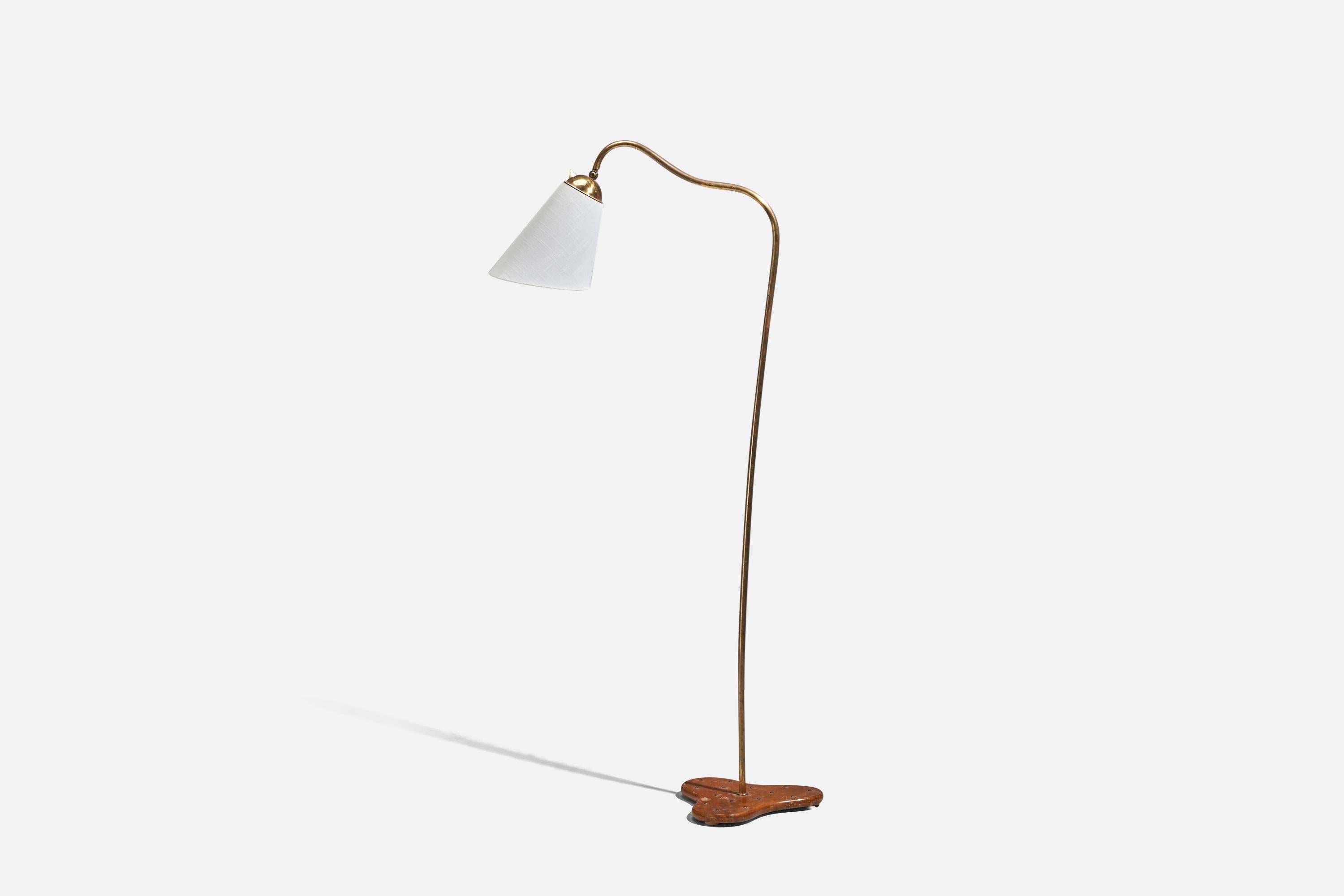 An adjustable, brass, wood and fabric floor lamp; design and production attributed to Böhlmarks, Sweden, 1930s.

Dimensions variable, measured as illustrated in first image.

Sold with Lampshade. Dimensions stated are of Floor Lamp with