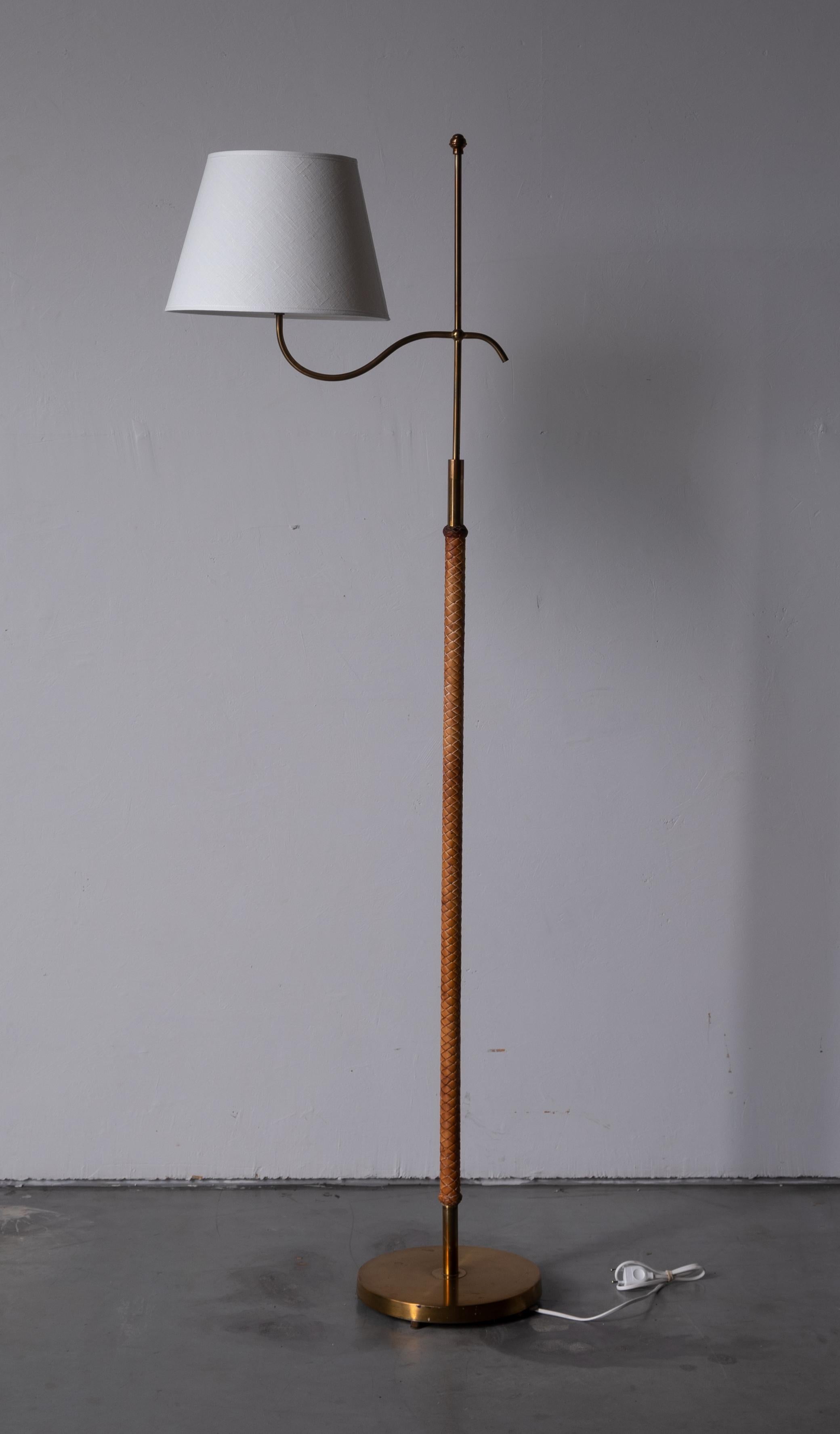 An adjustable floor lamp. In brass, finely braided leather. Production attributed to Böhlmarks, Sweden, 1940s. 

Other designers of the period include Josef Frank, Paavo Tynell, Hans Bergström, Böhlmarks, and Jean Royère.