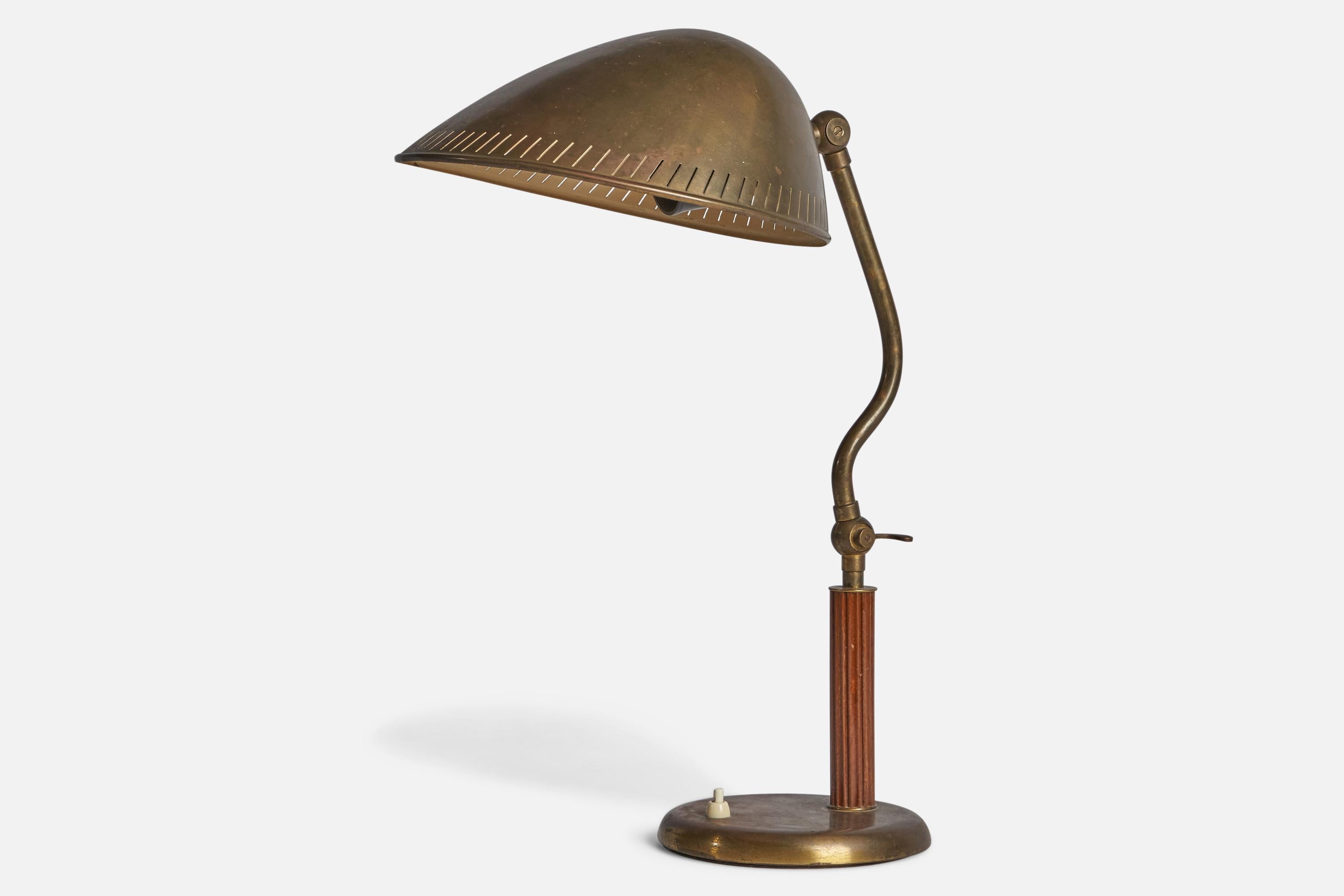 An adjustable brass and elm table lamp, designed and production attributed to Böhlmarks, Sweden, 1930s.

Overall Dimensions (inches): 18.25” H x 9.5” W x 12” D
Bulb Specifications: E-26 Bulb
Number of Sockets: 1
All lighting will be converted for US