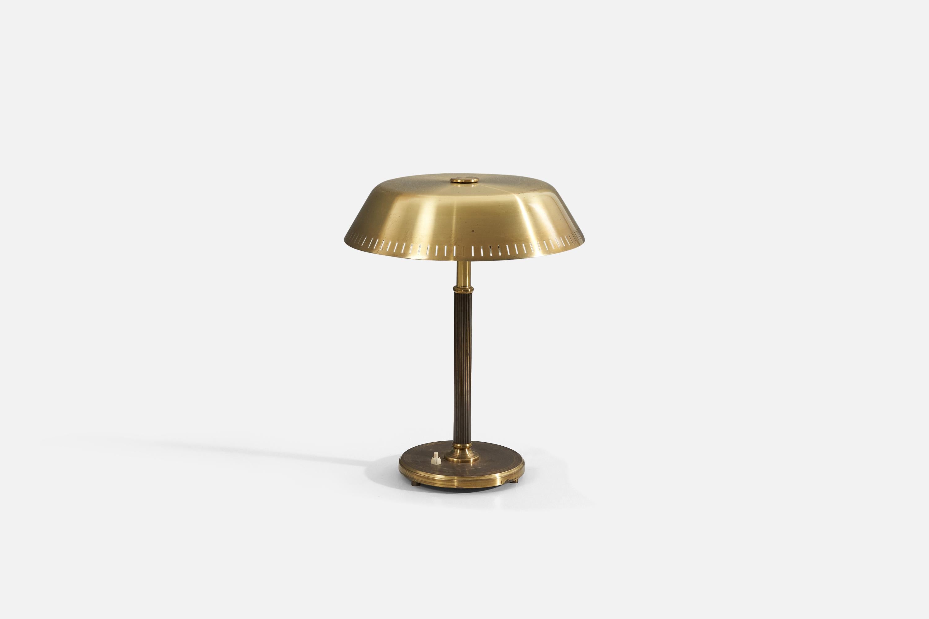 A brass table lamp attributed to Böhlmarks, Sweden, 1940s. 


.