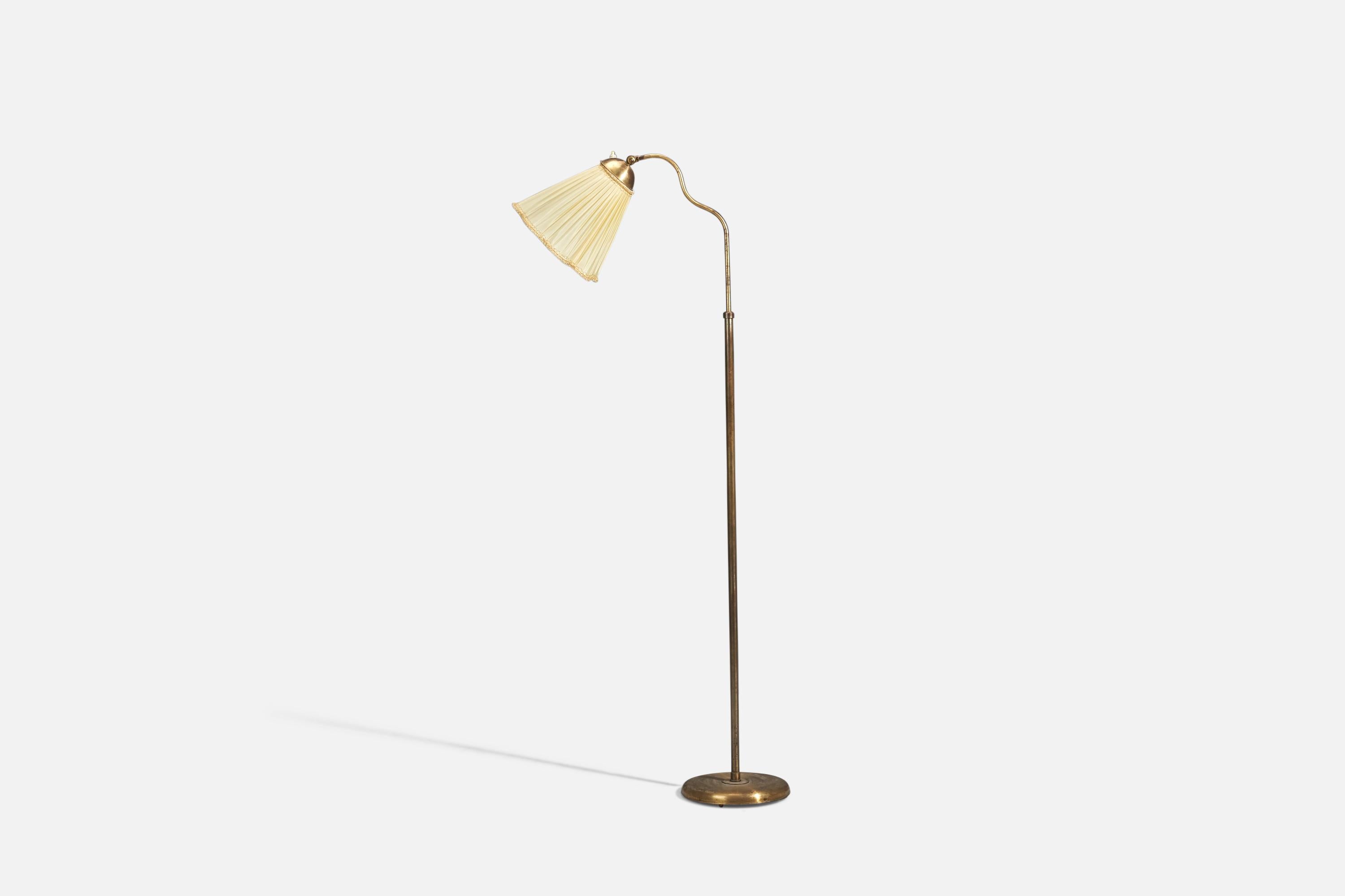 An adjustable brass floor lamp produced by Böhlmarks, Sweden, 1940s.

Dimensions variable, measured as illustrated in first image.

Dimensions stated are of Floor Lamp with Lampshade. 

Socket takes standard E-26 medium base bulb.

There is no