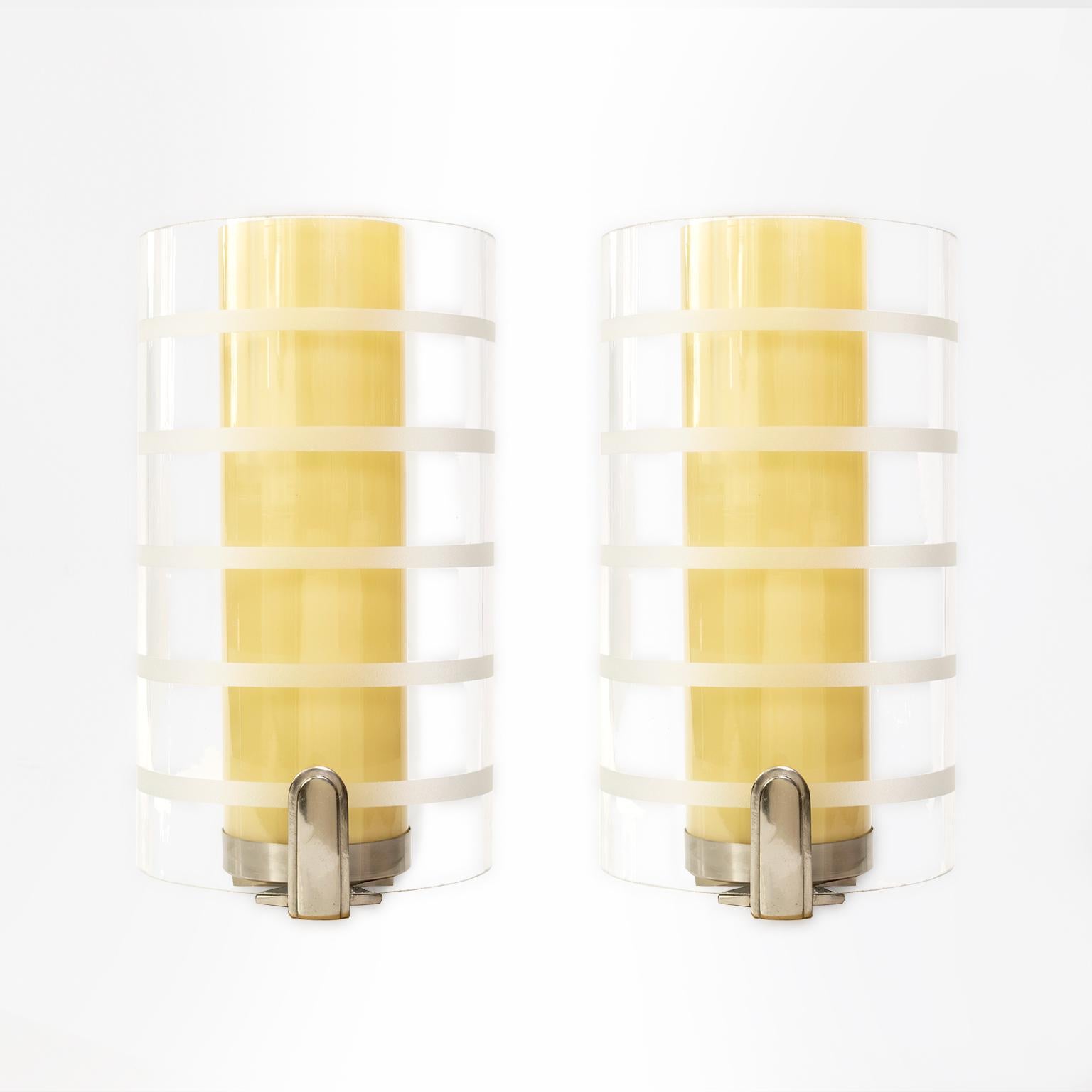 Pair of Scandinavian Modern, Art Deco double glass shade on opaque the other clear with acid etched horizontal stripes. Newly rewired one standard socket each for the USA.
 
Measures: Width 8