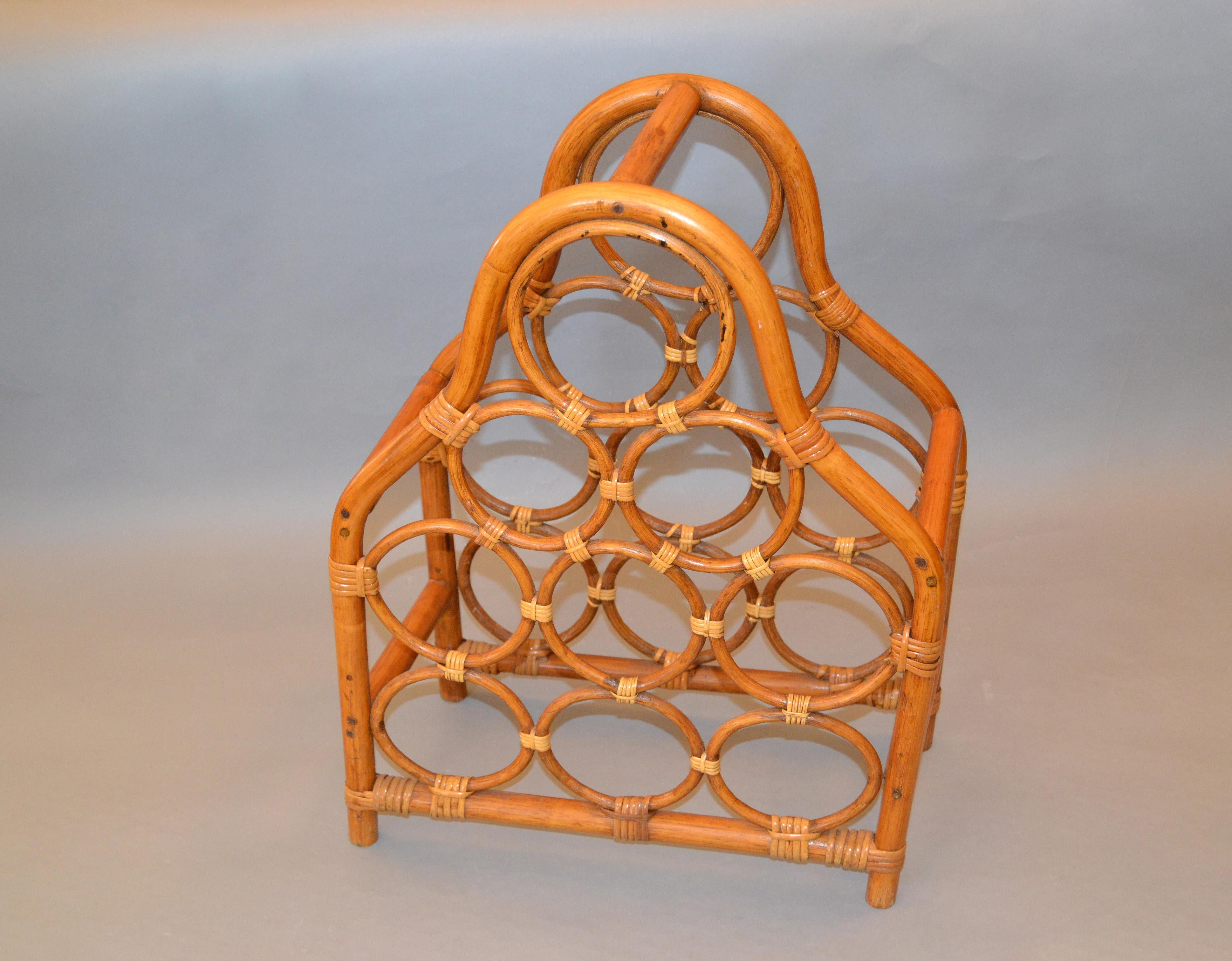 Vintage boho chic handcrafted bamboo and rattan nine bottle wine rack, wine storage, wine basket.
The wine caddy, basket is sturdy crafted and is easy to carry.
It is made to hold 9 bottles.