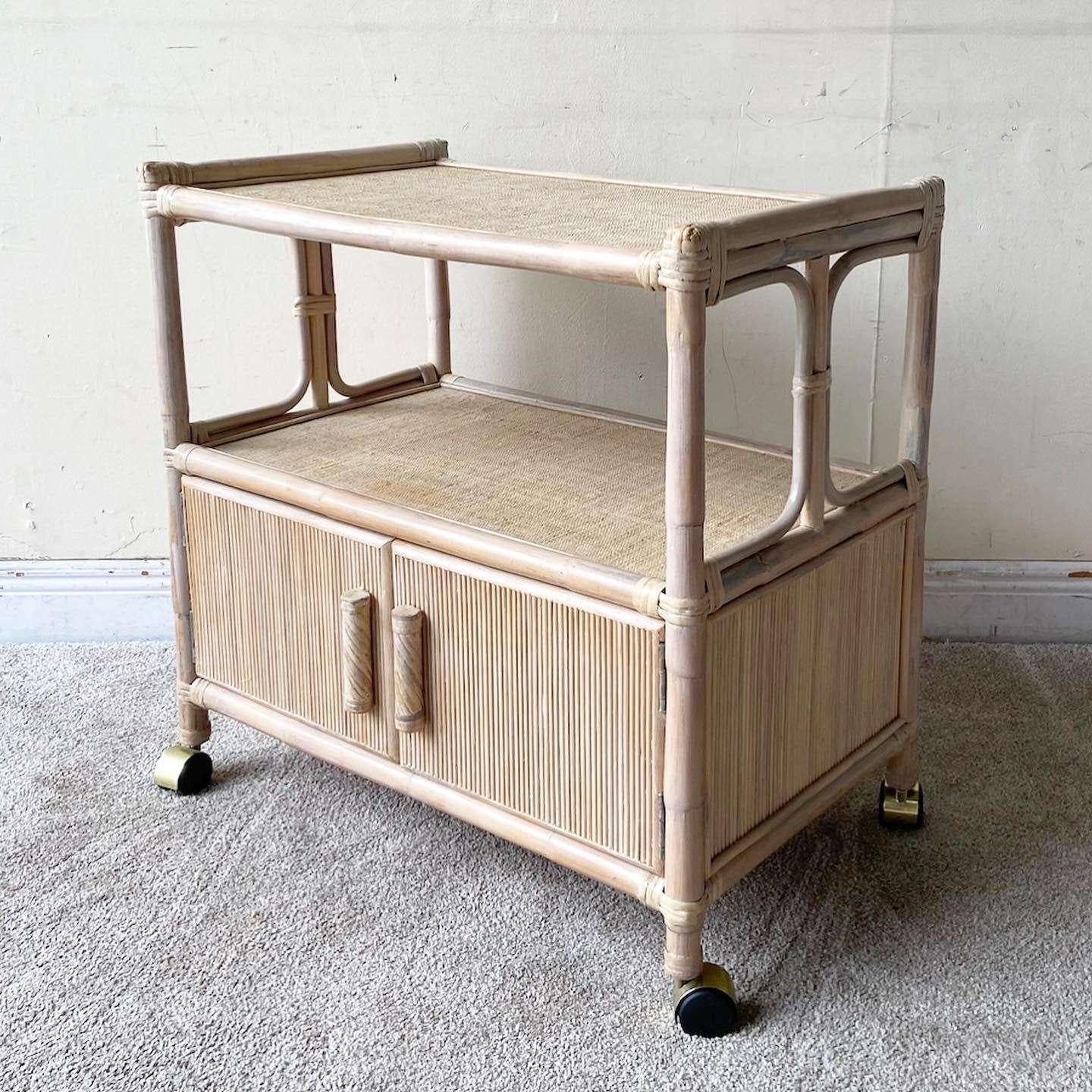 Amazing boho chic bamboo rattan cart. Features teen handles and cabinet door with woven woken tops on each tier.
