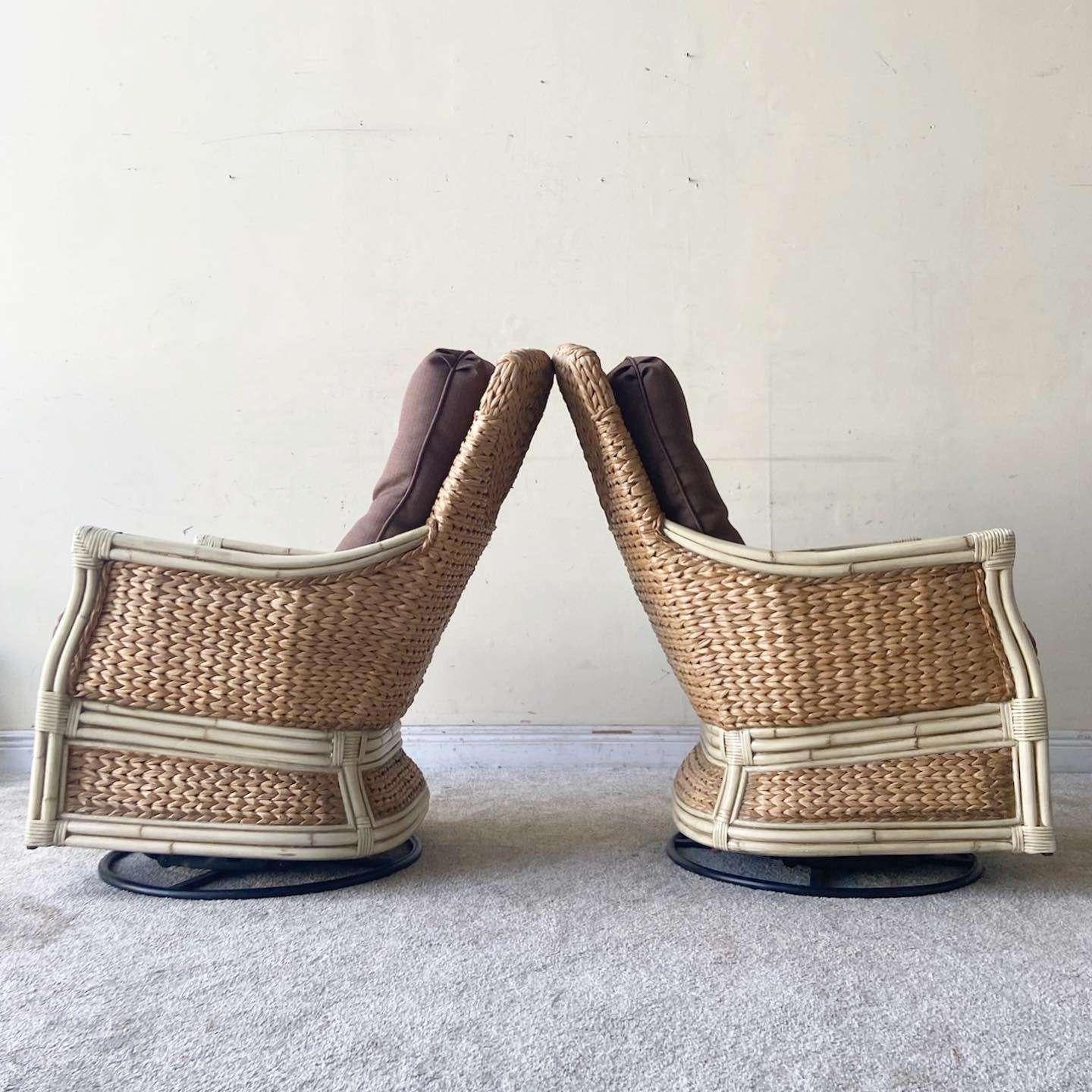 Amazing vintage handmade bohemian rocking swivel chairs. Each feature a painted cream bamboo and rattan frame with woven sea grass through out the chairs.

Seat height is 20.5 in