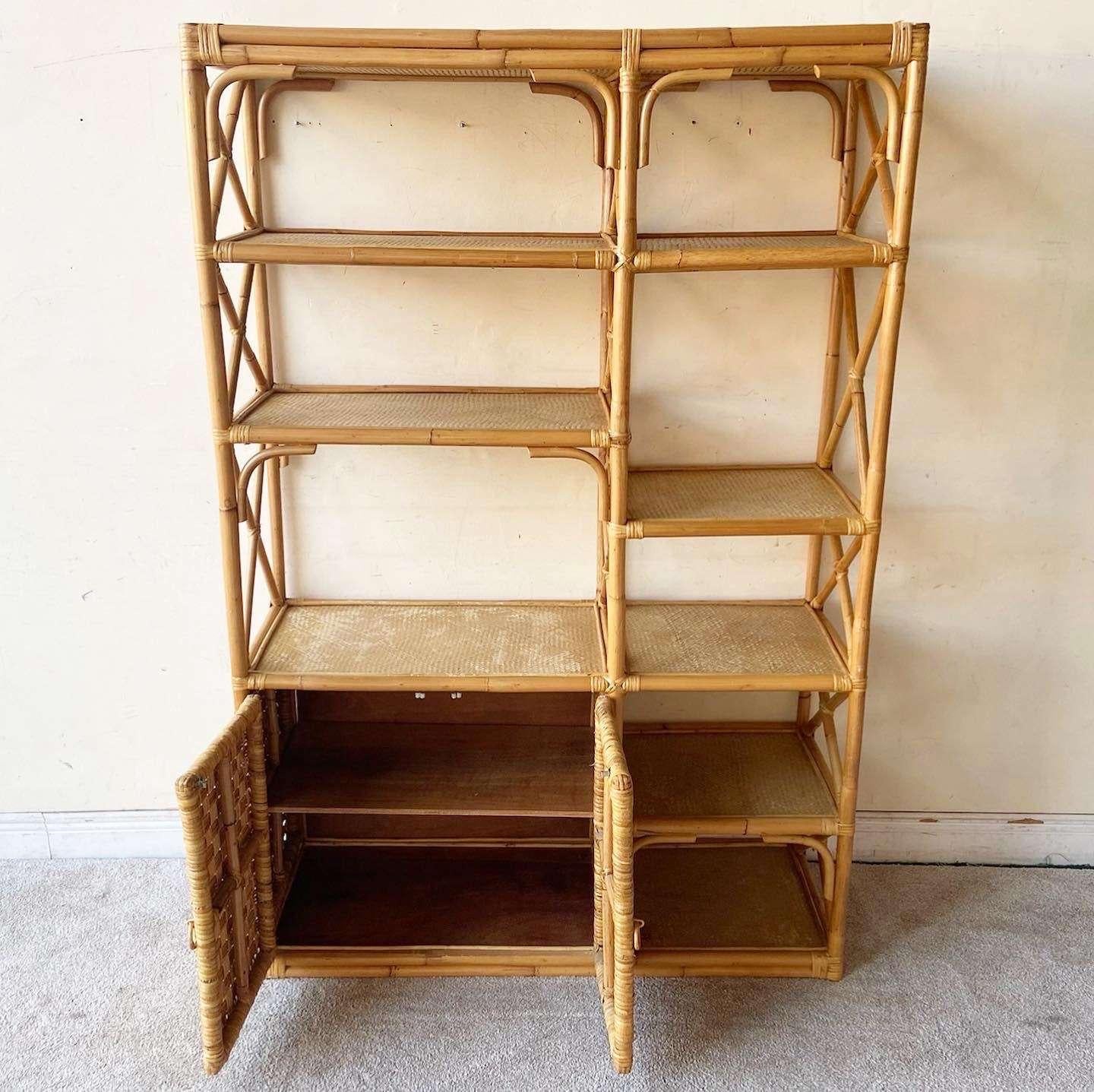 Exceptional vintage bohemian bamboo and rattan Etagere/bookcase. Features slicer cabinet doors and shelving.