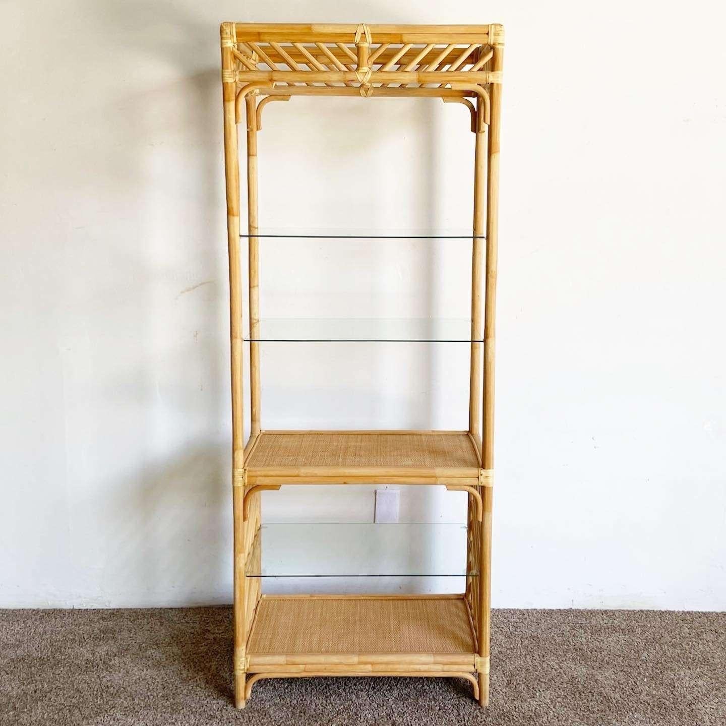 Wonderful vintage bohemian bamboo rattan Etagere. Features a fantastic construction with 3 glass shelves.
