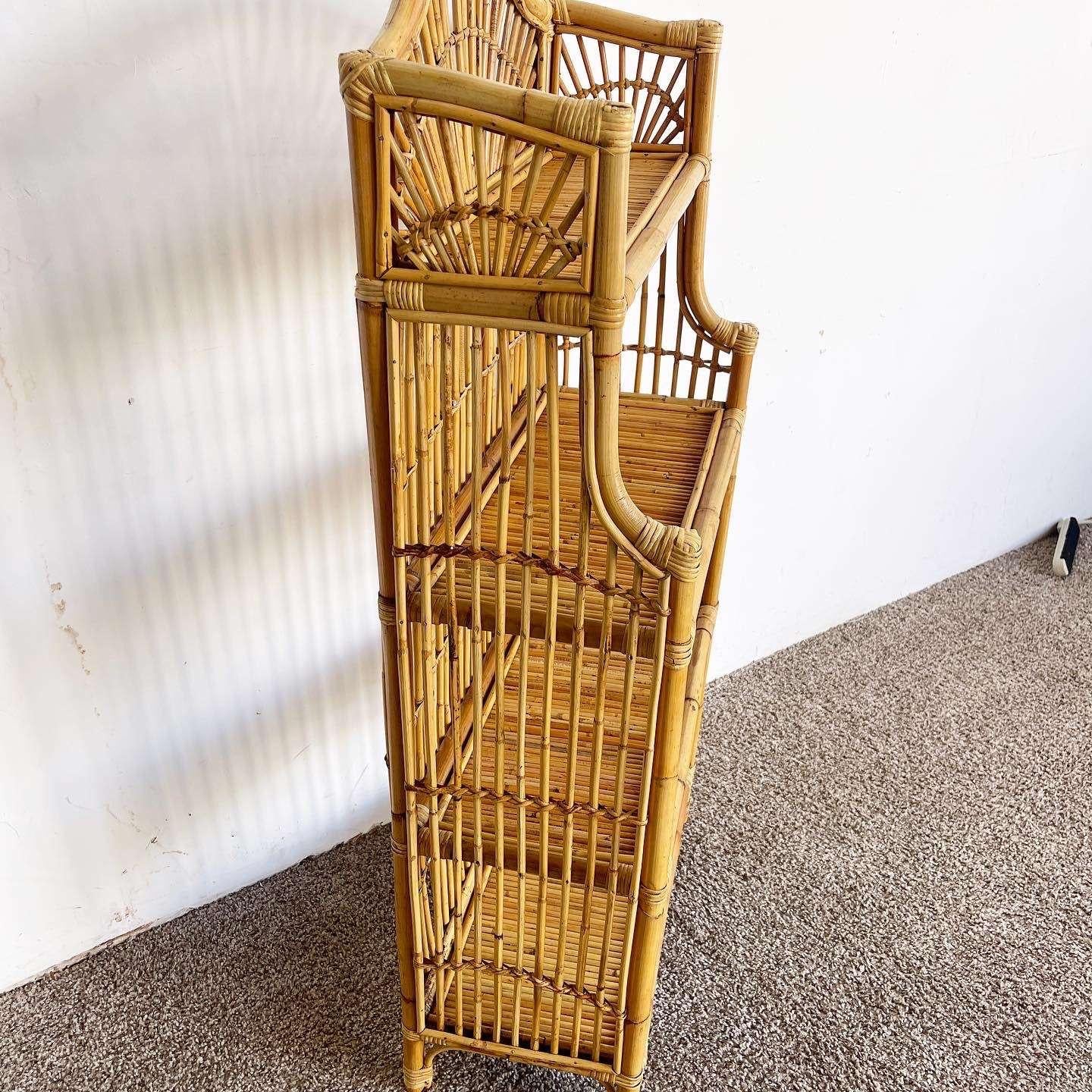Immerse yourself in the captivating boho chic vibe with this exceptional vintage bamboo rattan Etagere. Notably, its fantastic open shelving design creates an airy and spacious feel, while the bamboo throughout the surfaces adds a natural and