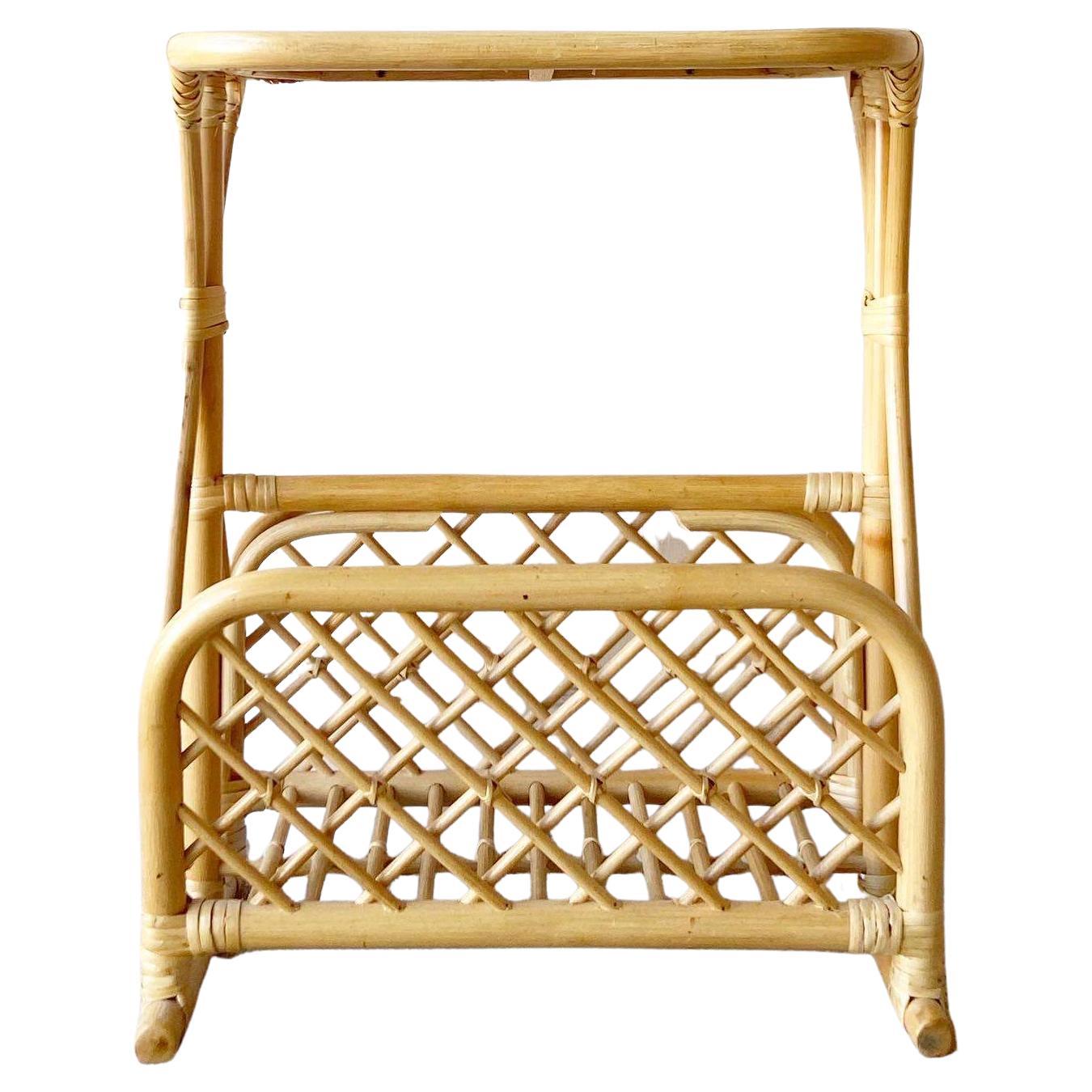 Exceptional vintage boho chair bamboo rattan magazine rack/side table. Features a wonderful sculpted design with a blonde finish and wicker top.
