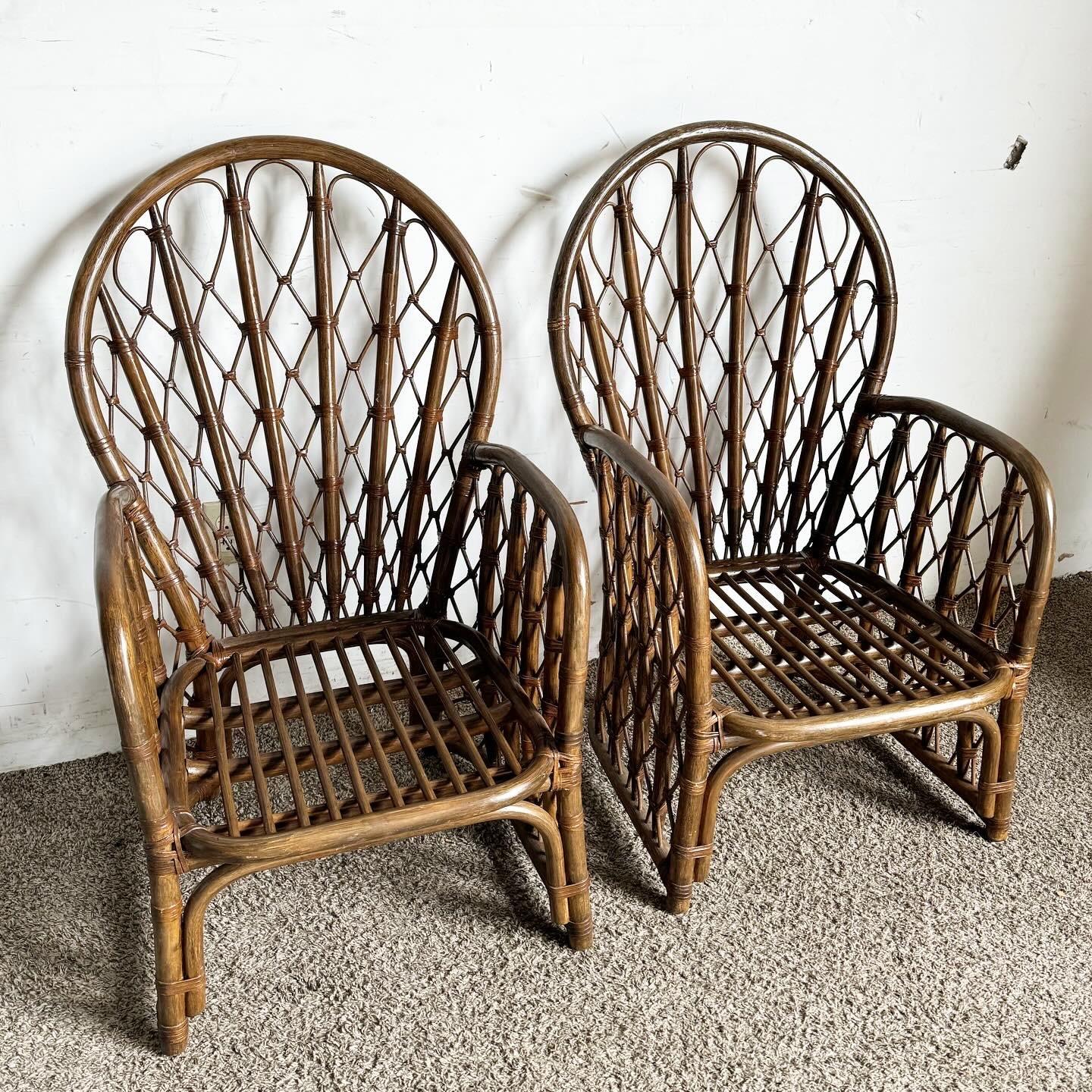 Discover the timeless elegance of Boho Chic Bamboo Rattan Peacock Chairs, a pair that features the iconic fan-shaped backrest radiating like a peacock's tail. Crafted from natural bamboo and rattan for durability and comfort, these statement chairs