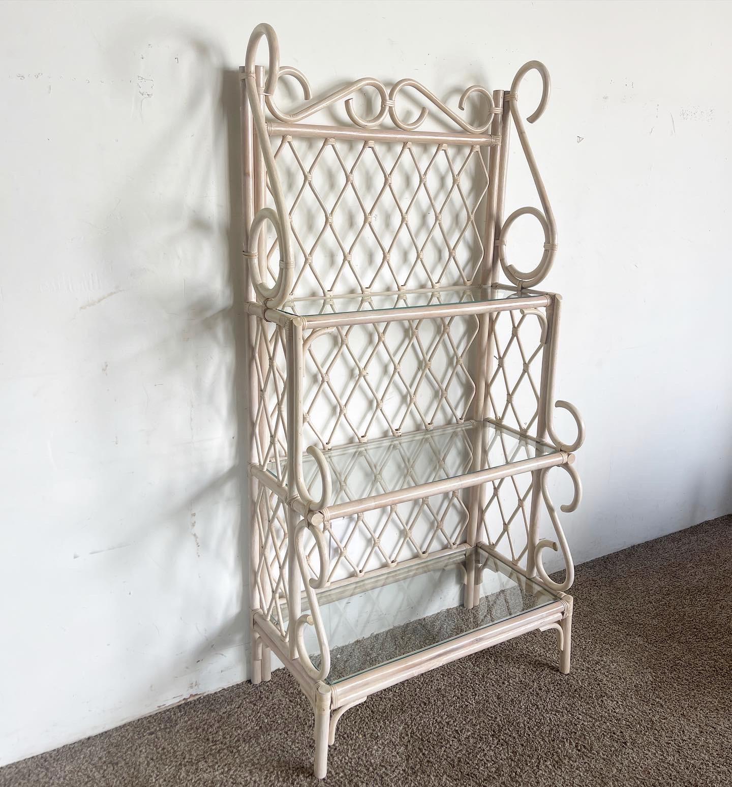 Unveil the enchanting Whitewash Bamboo Baker's Rack/Etagere, a remarkable embodiment of Boho Chic aesthetics that seamlessly merges striking style with practical storage solutions, making it a captivating statement piece for your living