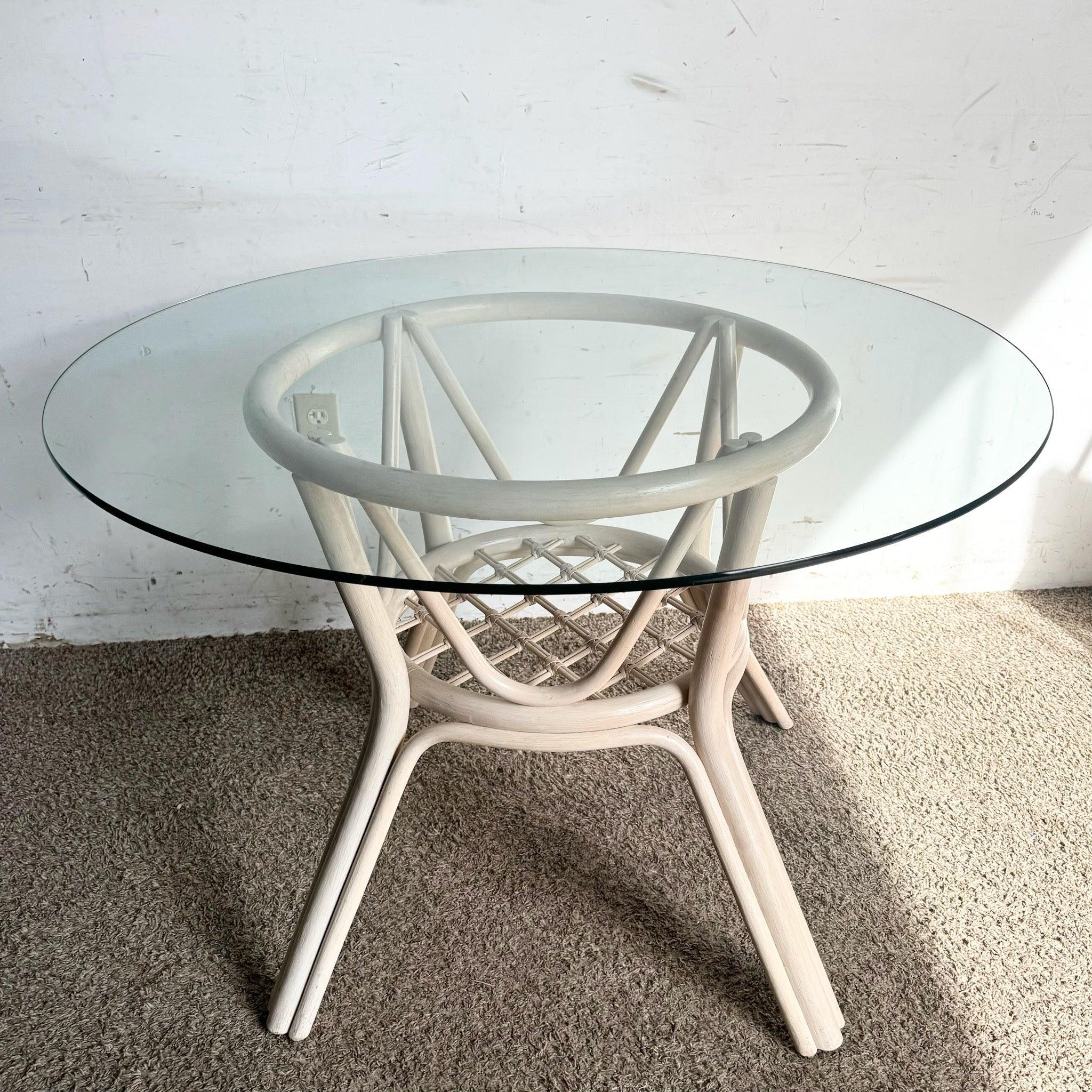 Boho Chic Beige Rattan Dining Table with a glass top and intricately woven base. Perfect for bohemian and coastal-inspired interiors.
 
 We sell items as acquired, without restoring or repairing. Vintage pieces may have age-related wear. Review