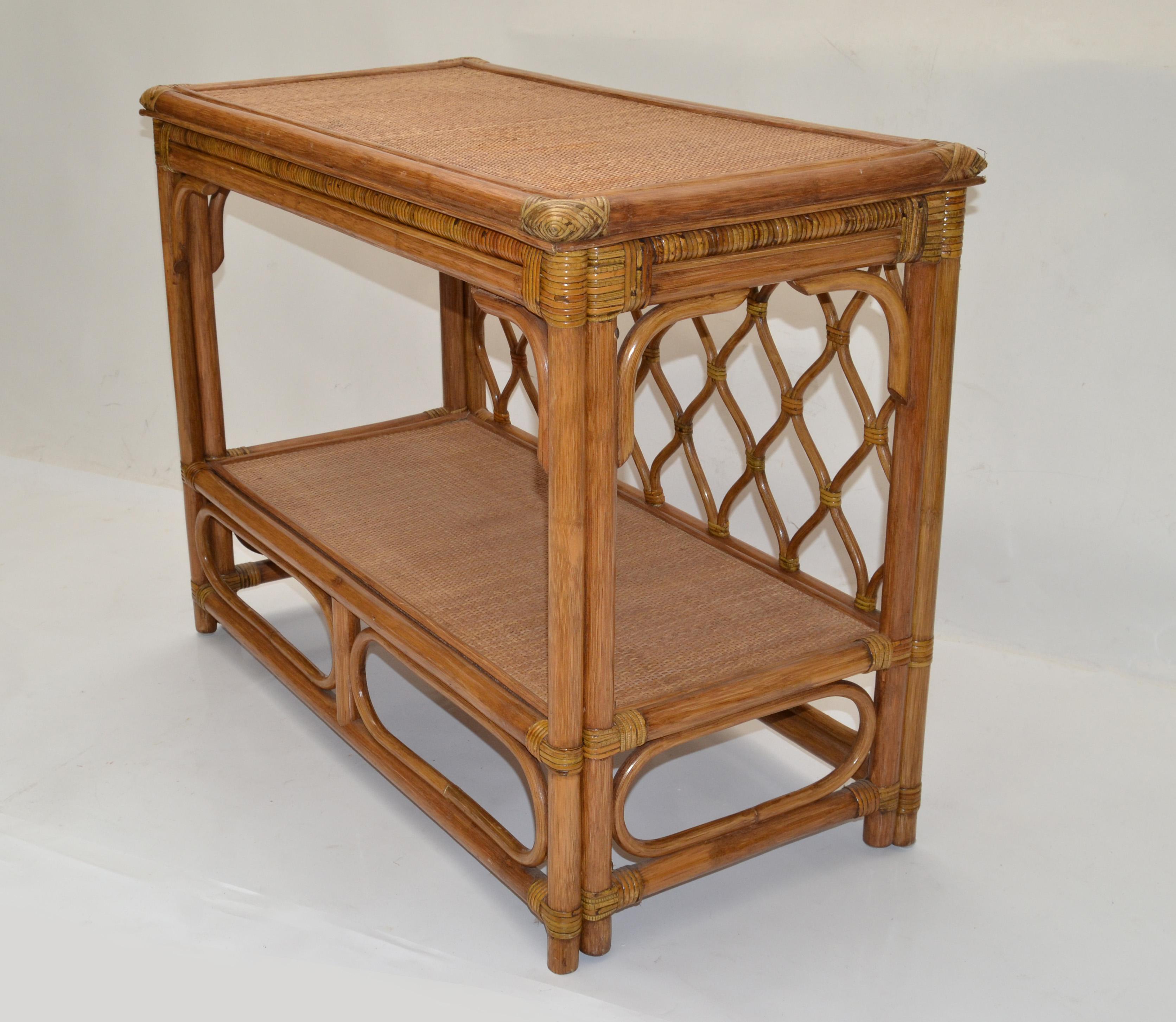 Mid-Century Modern Boho Chic rectangular bamboo Console with a handwoven Cane Top and bend Bamboo corners.
Useful as Dry Bar, Serving Table or storage shelf.
Great for your party room or wine cellar.