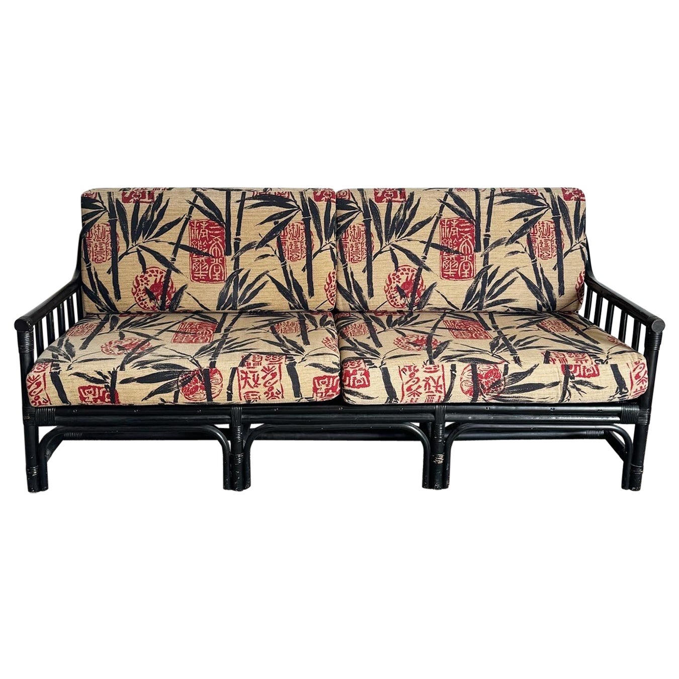Boho Chic Black Wicker Rattan Sofa With Tan Red and Black Cushions