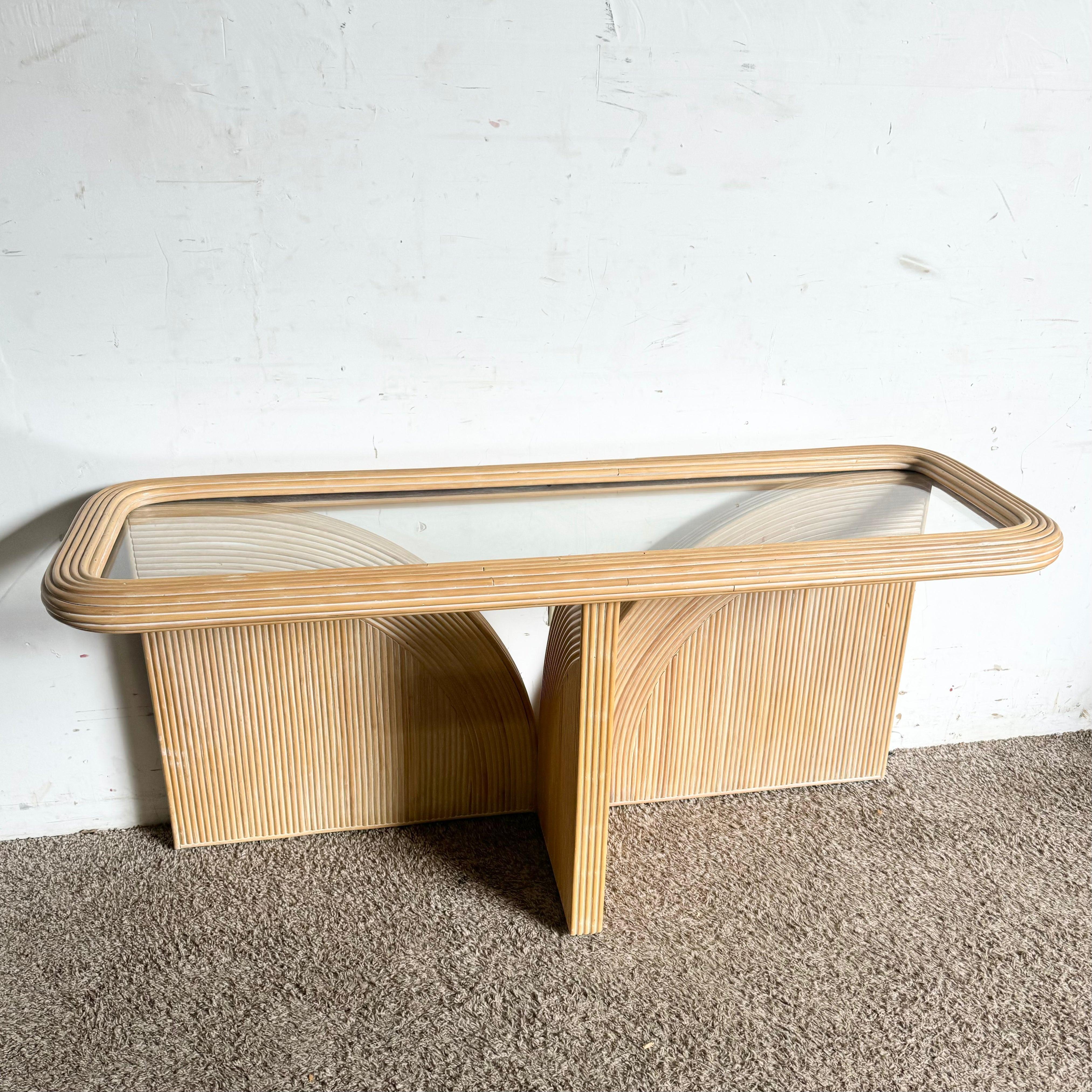 Boho Chic Blonde Pencil Reed Console Table with a glass top adds vintage charm to your decor, perfect for entryways or living rooms.
 
 Due to the nature of the construction of these tables they are a little wobbly. They are not going to fall over