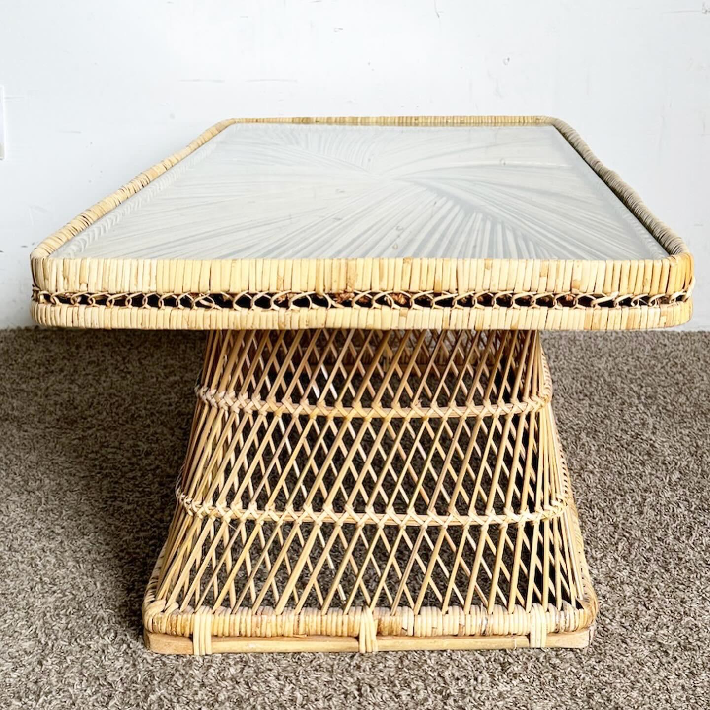 Bring a natural, bohemian vibe to your home with the Boho Chic Buri Rattan Glass Top Rectangular Coffee Table. This table combines the organic beauty of Buri rattan with a sleek glass top, offering both style and functionality. Its rectangular shape
