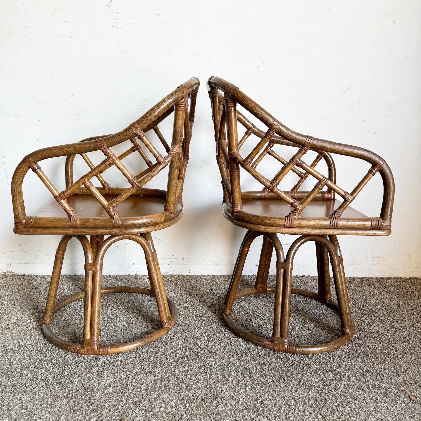 Boho Chic Chippendale Style Bamboo Rattan Swivel Arm Dining Chairs - Set of 4 In Good Condition In Delray Beach, FL
