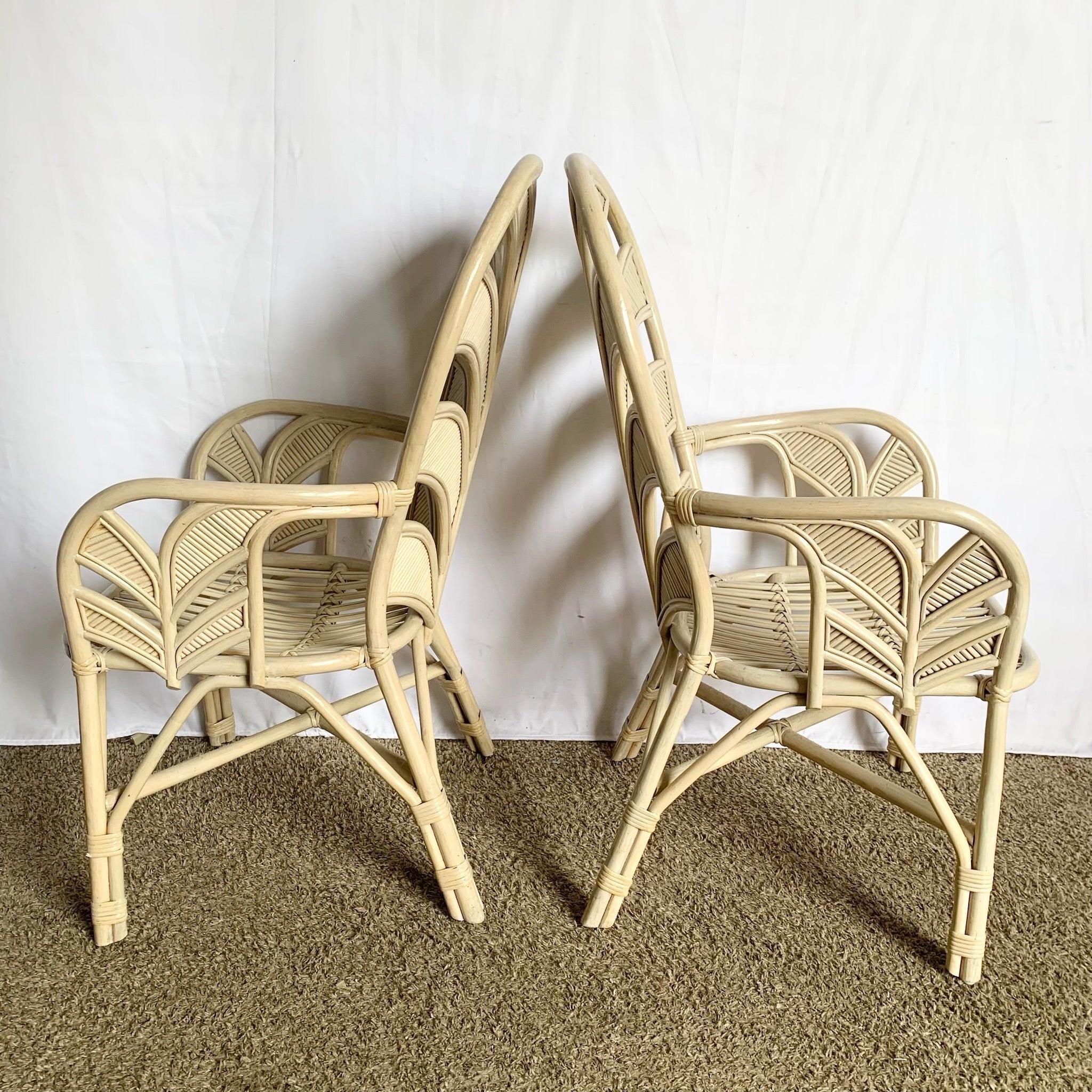 Coastal Sculpted Palm Frond Dining Chairs set of four—high‑back rattan with botanical frond design, airy elegance perfect for sunlit coastal interiors.
 

 Minor wear as shown in the photos.
 

 We sell items as acquired, without restoring or