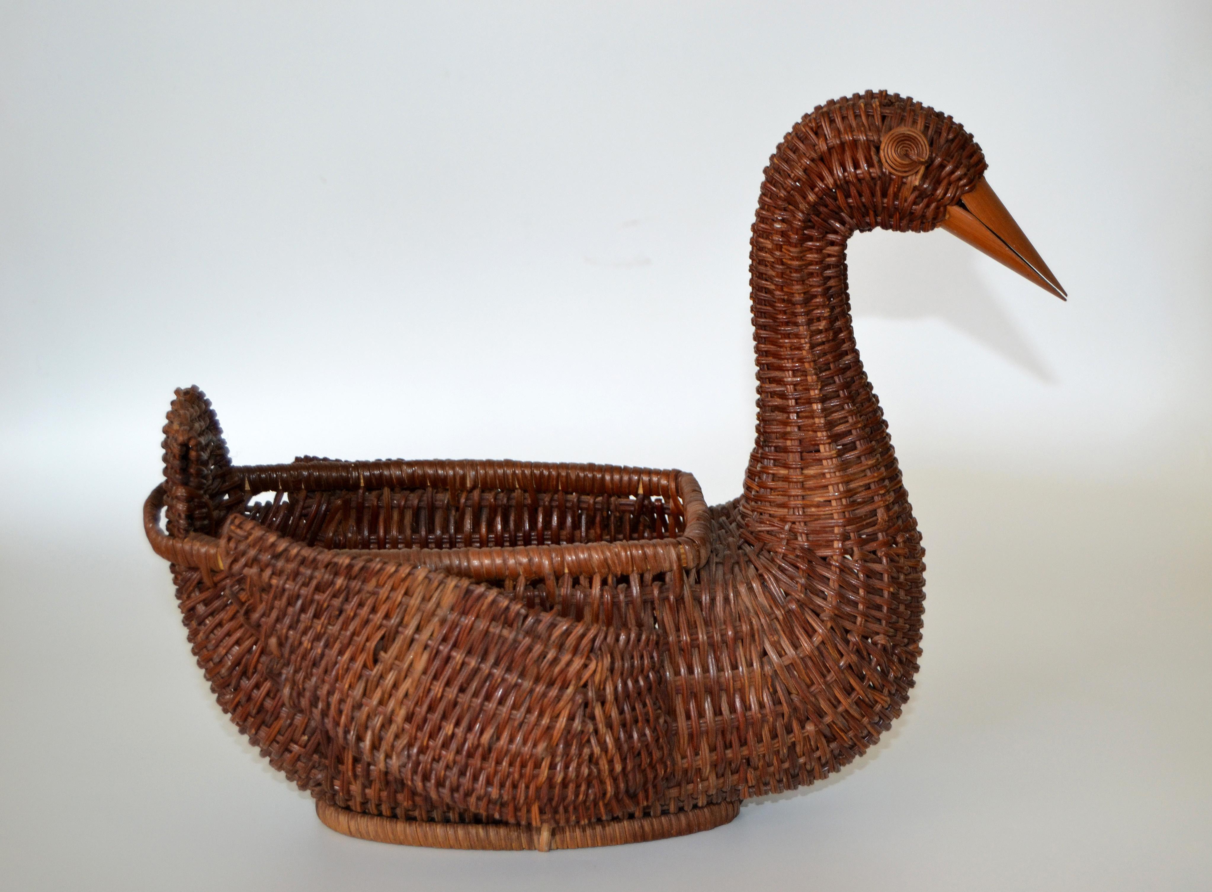 Boho chic decorative handcrafted woven reed Brown Duck shaped basket. 
Great unique form and shape made out of natural materials, an accent piece for any decor.
 