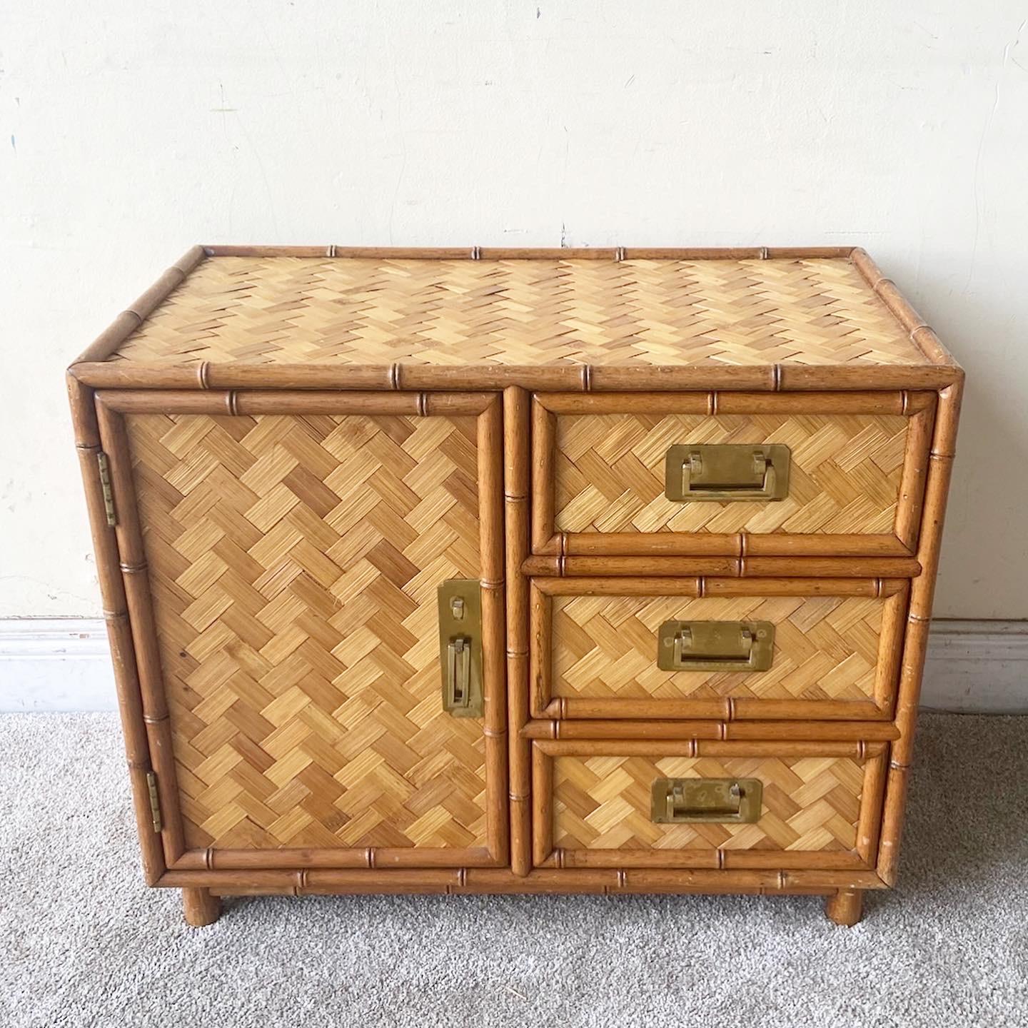 Exceptional vintage bohemian faux bamboo chest cabinet. Features brass handles with a woven herringbone throughout the piece.
 
