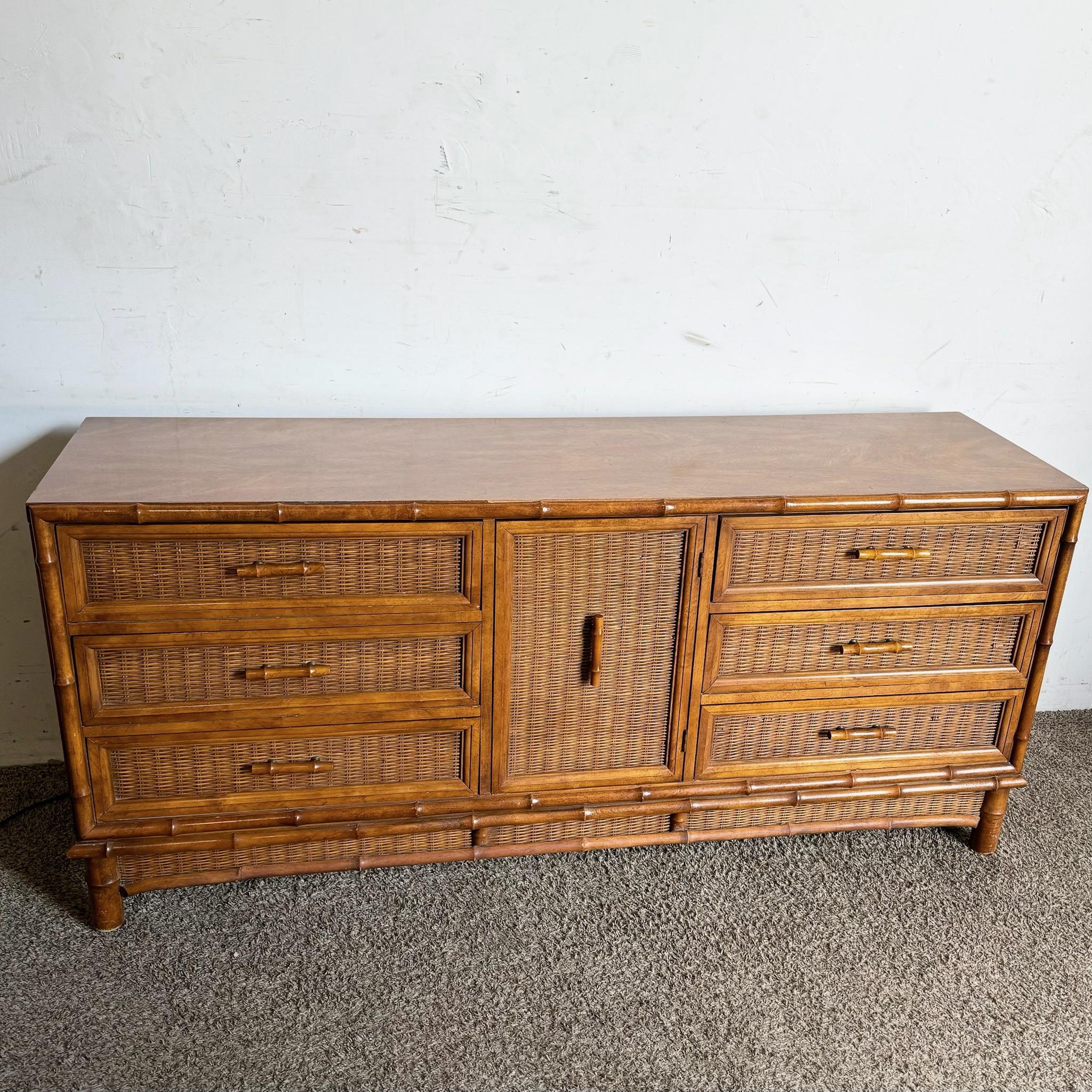 Bring natural texture and bohemian charm to your space with this Boho Chic faux bamboo wicker dresser by American of Martinsville. Featuring beautifully woven wicker and faux bamboo detailing, this dresser offers both ample storage and a laid-back,