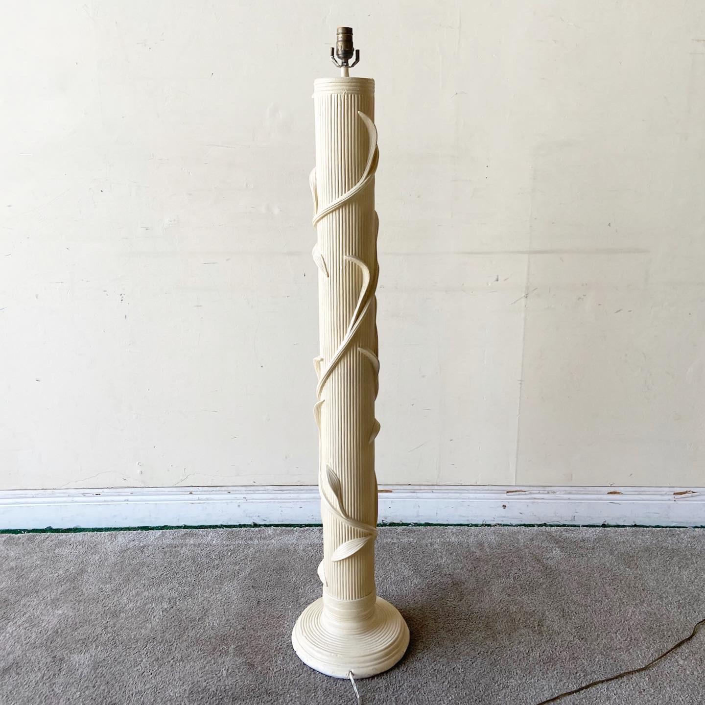 Incredible bohemian ceramic floor lamp. Features a faux pencil reed etched throughout the lamp body.

3 way lighting.