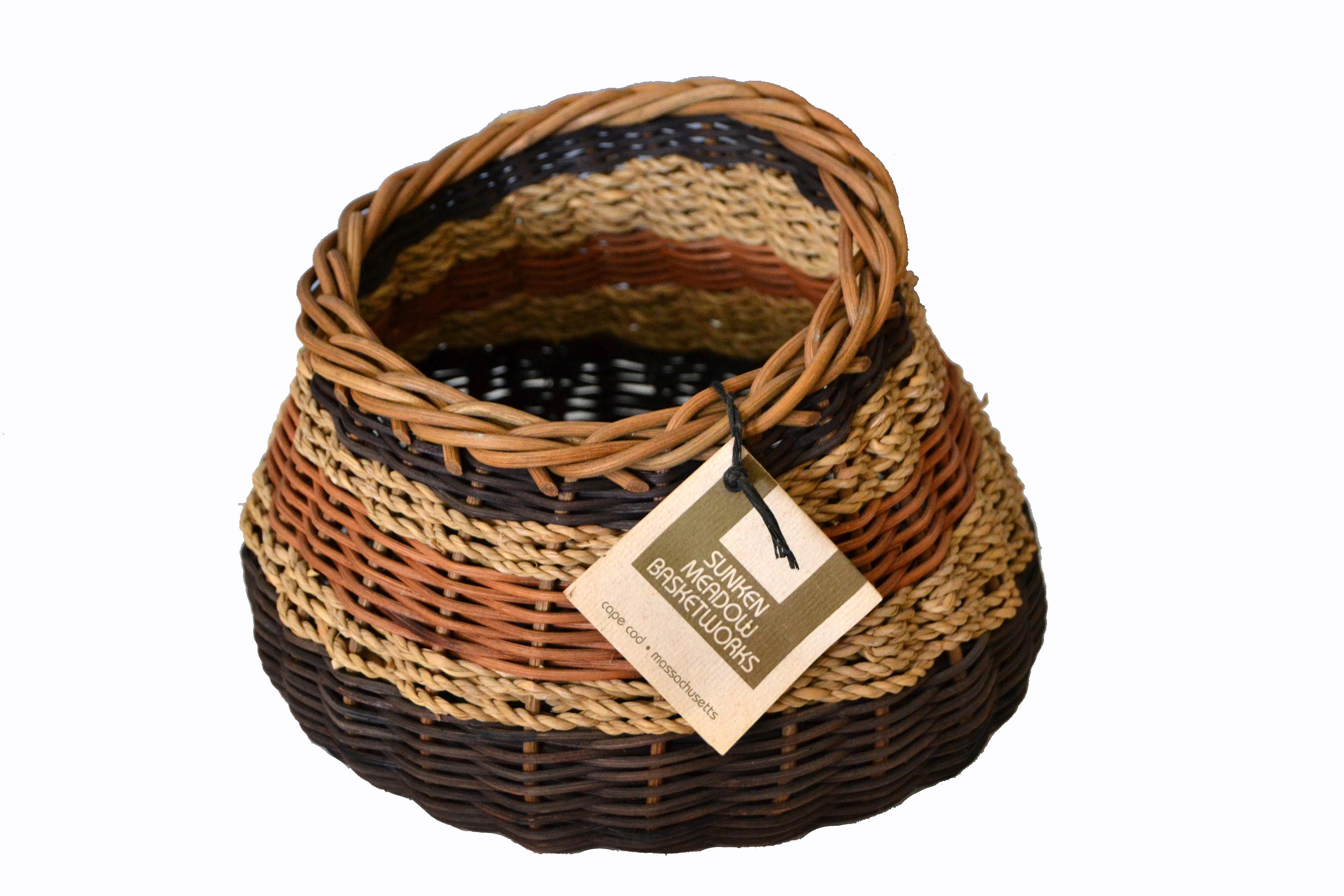 Boho chic handcrafted woven reed and seagrass Nancy basket by Paulette Lenney, Sunken Meadow Basketworks.
Great unique form and shape made out of natural materials, an accent piece for any decor.
Comes with the original paper tag.