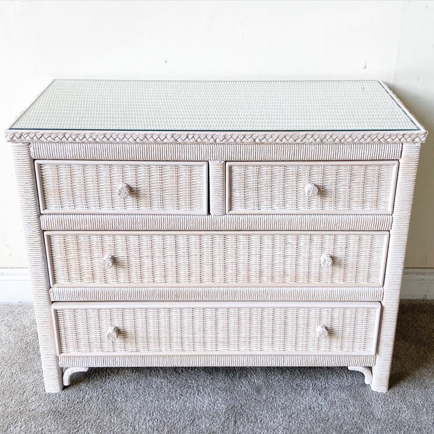 Exceptional 4 drawer dresser by Henry Link for Lexington Furniture Co. Features a wicker weave through out the dresser with a rattan frame. Desk has a glass top and a whitewash finish.