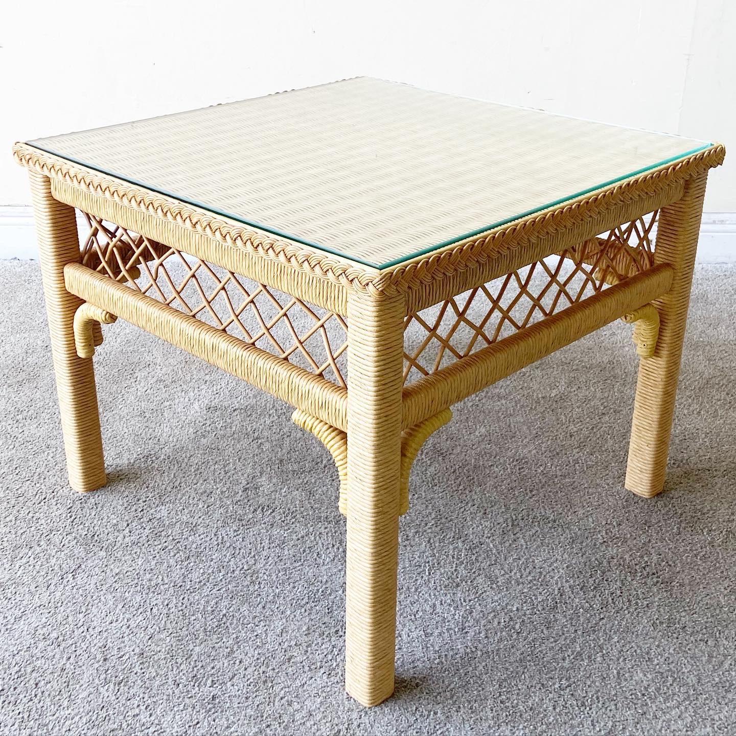 Exceptional bohemian side table by Henry link. Table features woven wicker and rattan frame with a glass top. There are no marks which read Henry Link on this table.