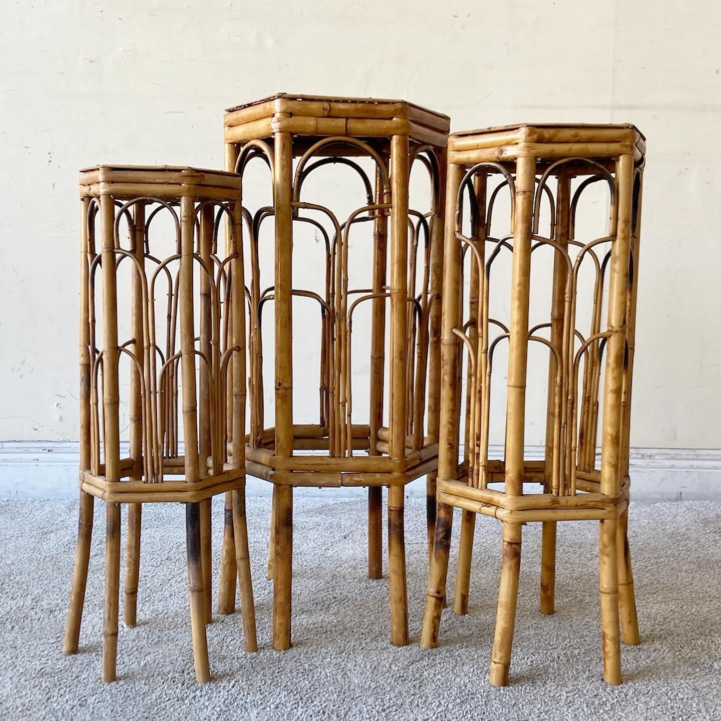 Incredible set of three vintage boho chic nesting tables. Each table is constructed of a tortoise shell bamboo.

Medium measures 11”w, 9.5”D, 28”H
Smallest measures 8.5”W, 7.5”D, 25.5”H.