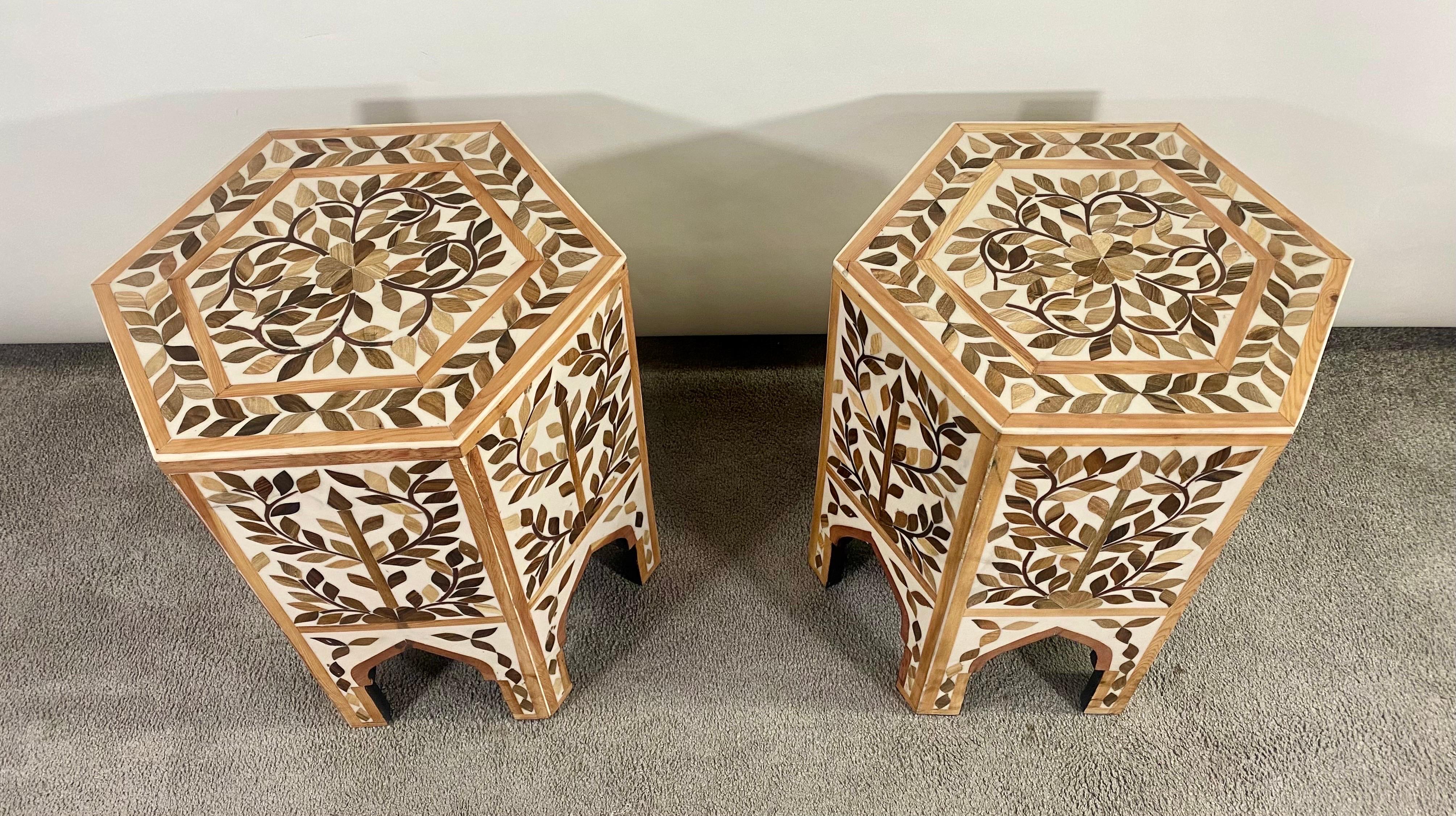 An exquisite pair of boho chic / Bohemian Moroccan style side or end table featuring an hexagonal shape. The handmade tables are finely decorated in leaves Pattern and beautiful arches, a staple of the Moorish timeless architecture and design.