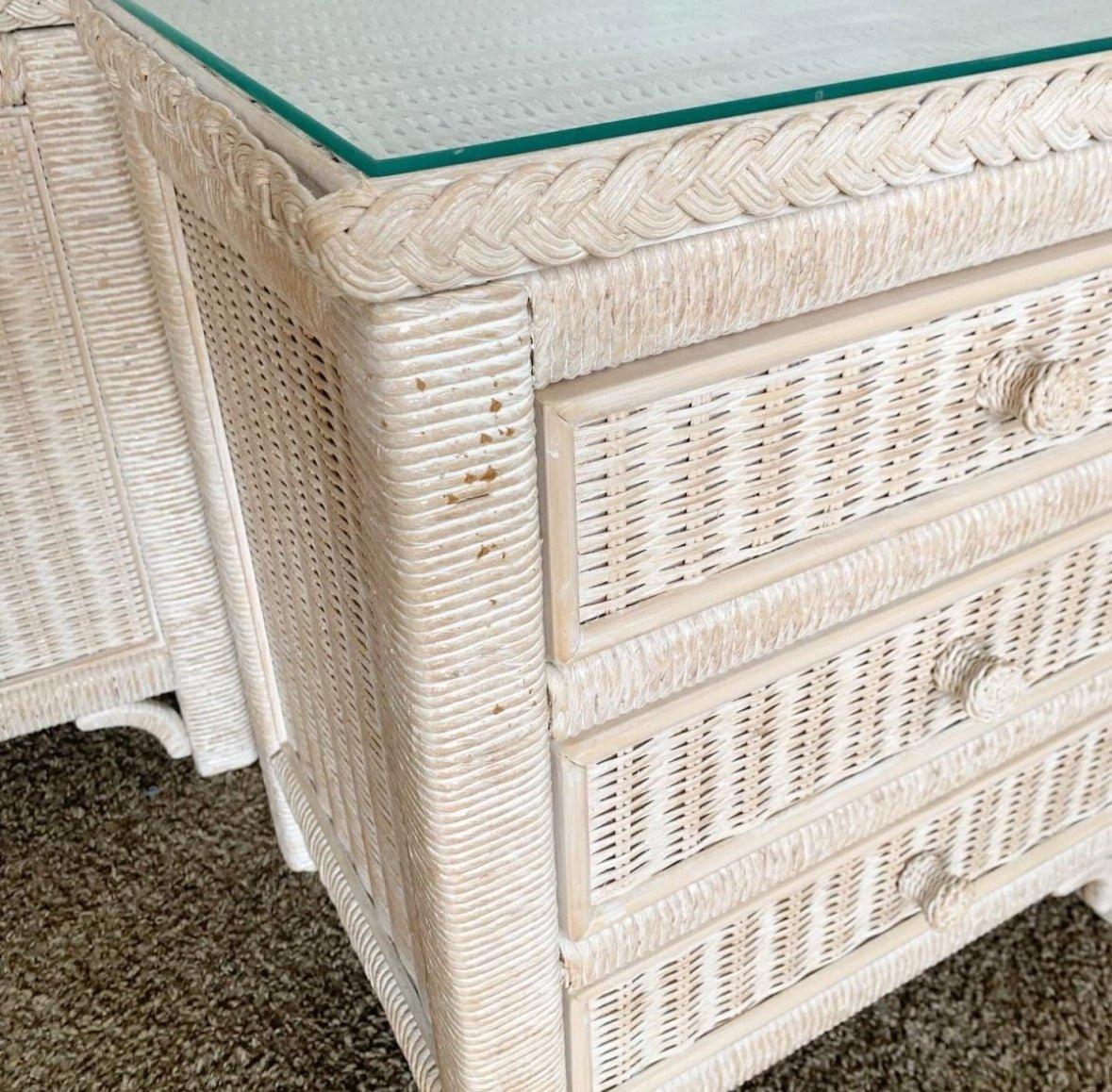 Add a touch of boho chic to your space with the wonderful vintage Lexington wicker rattan commode/nightstand by Henry Link. This piece features an inlaid glass top, pickle pink finish, and provides both style and functionality.

Wonderful vintage
