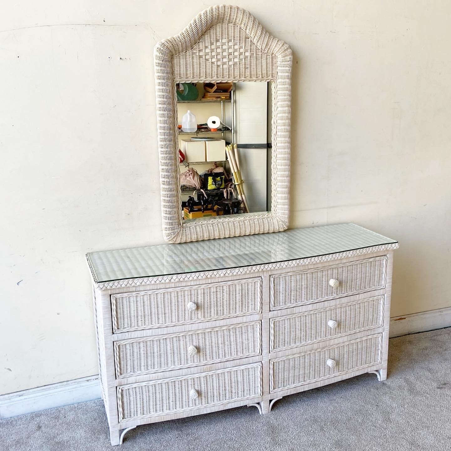 Amazing vintage boho chic wicker dresser with a matching mirror and glass top. Feature an off white finish with 6 spacious drawers.

Mirror measures 28”W, 2.5”D, 44.5”H.