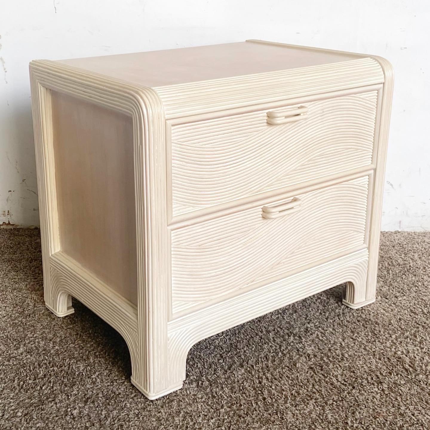 The Boho Chic Pencil Reed Nightstand by American Drew - a blend of unique texture, bohemian spirit, and impeccable craftsmanship.

Boho Chic Pencil Reed Nightstand by American Drew.
Distinctive pencil reed design embodies bohemian spirit.
Seamlessly