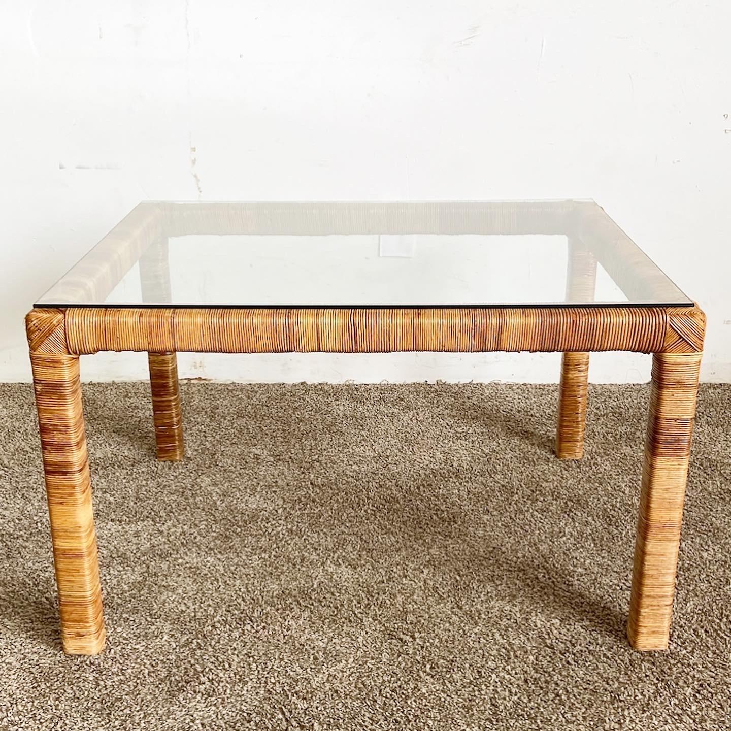 Enhance your living room with the exceptional vintage boho chic coffee table. Constructed with a thick bamboo frame, this table features rattan with an inlaid glass top and a wicker lower tier, combining style and functionality in a unique two-tier