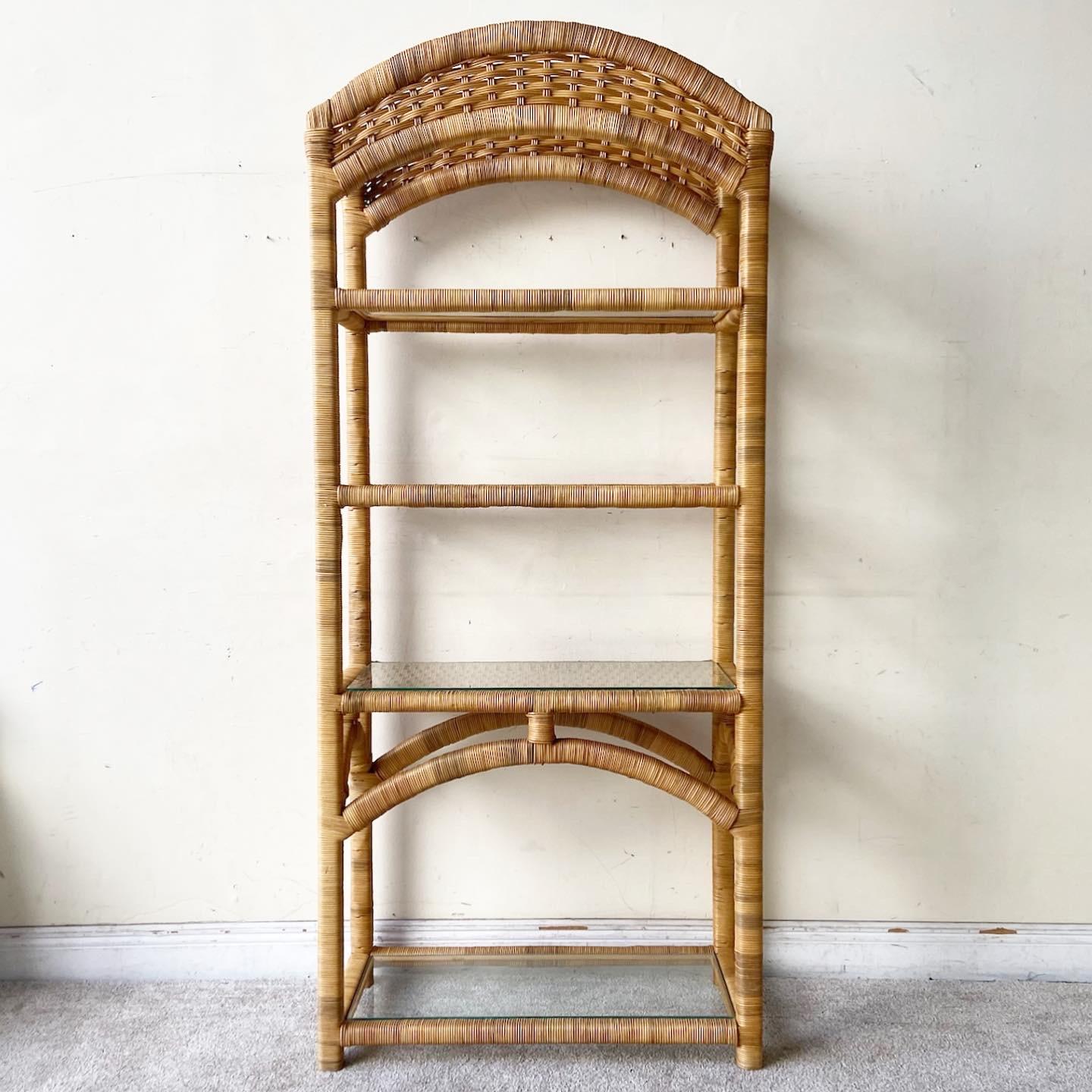 Amazing vintage bohemian Etagere with glass shelves. Features a woven rattan though the entire unit.
   