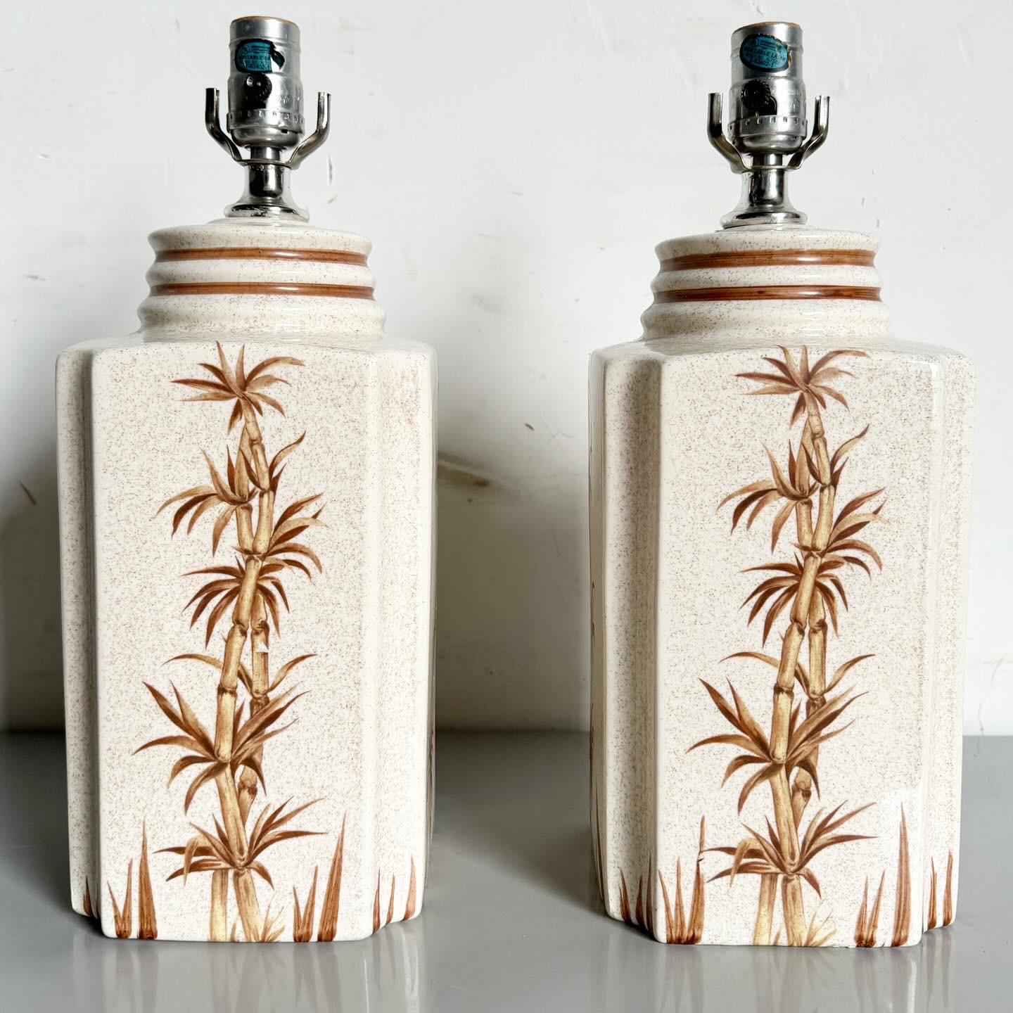 Illuminate your space with the Boho Chic Regency Ceramic Table Lamps, featuring hand-painted bamboo plants. These lamps blend Bohemian and Regency styles with their delicate bamboo motifs on a ceramic base, offering a serene and sophisticated touch.