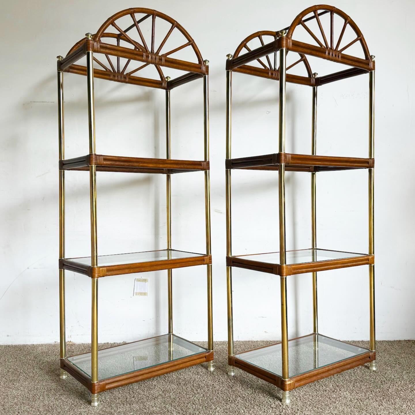 The Boho Chic Regency Gold and Bamboo Rattan Etageres, a pair, blend regal elegance with natural textures. Featuring gold-toned metal frames and bamboo rattan shelves, they offer a luxurious yet earthy look. The gold frames add glamour, while the