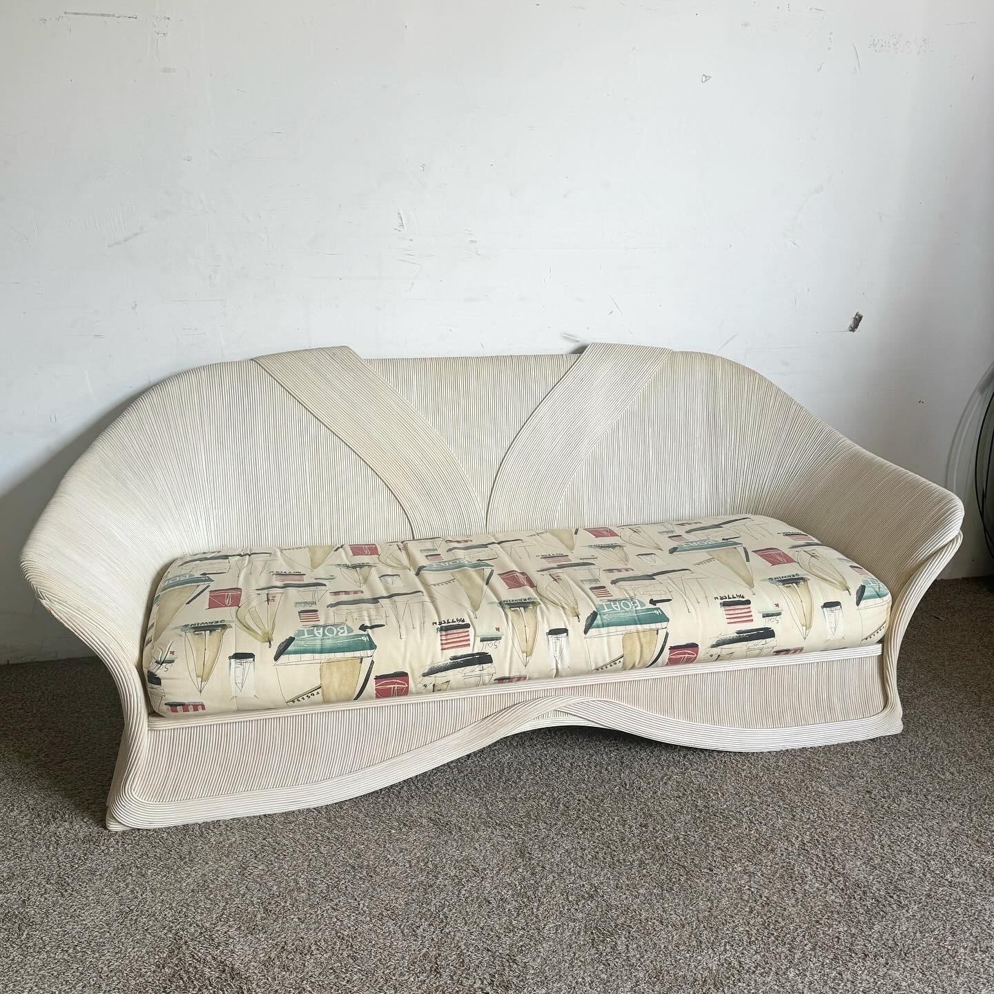 Dive into the bohemian elegance with the Boho Chic Ribbon Pencil Reed Sofa, a masterpiece of craftsmanship and design. Featuring intricate ribbon pencil reed construction, this sofa showcases natural beauty and texture, offering a sophisticated yet