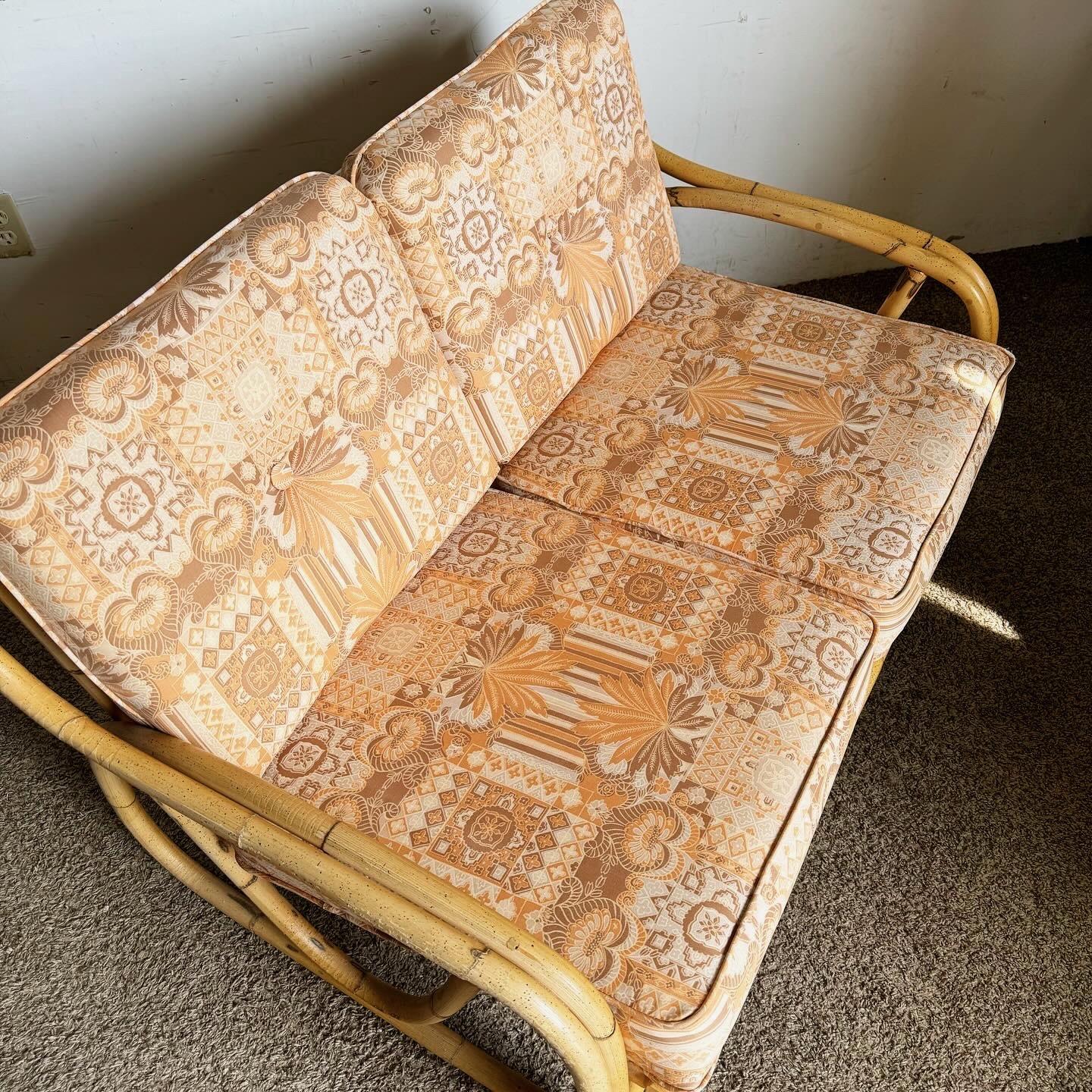Philippine Boho Chic Sculpted Bamboo Rattan Loveseat With Patterned Tufted Cushions For Sale